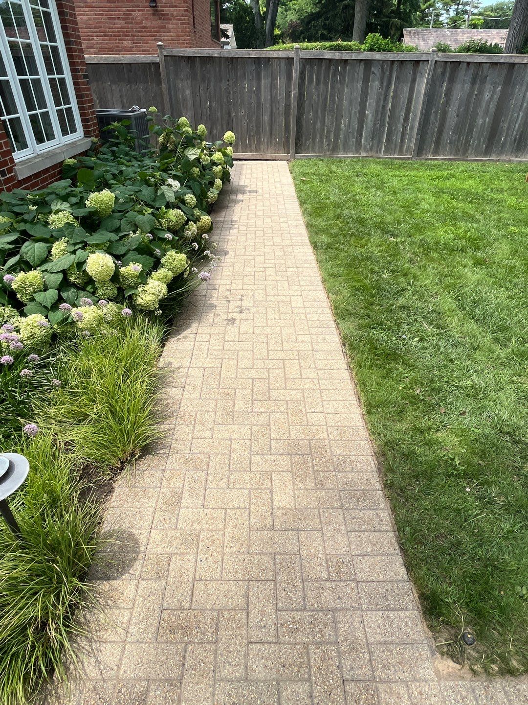 Brick patio repair, clean sand and seal by Northern Power Washing LLC.