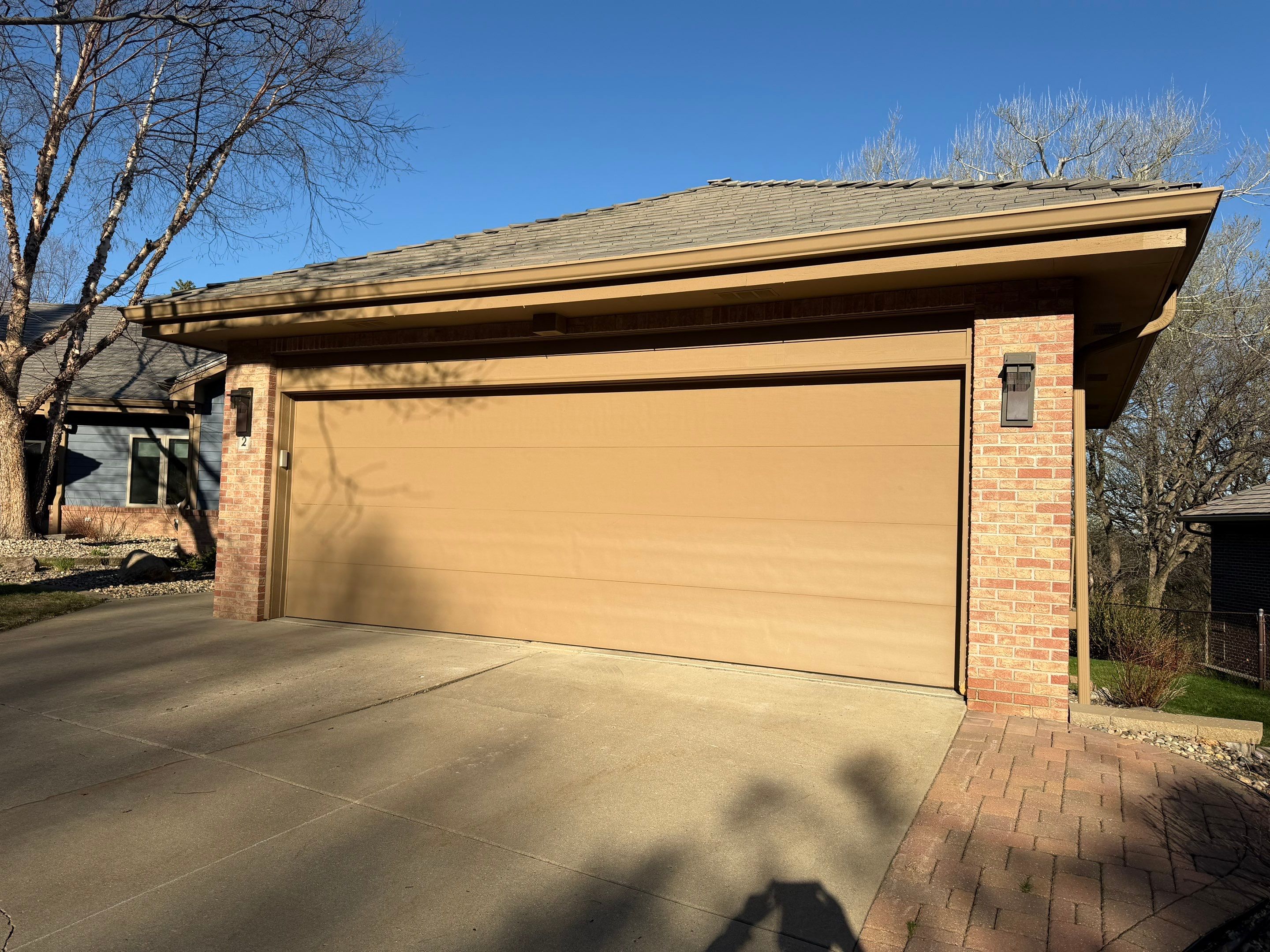 Residential Exterior Painting and Siding Refresh in Sioux Falls by Select Painting, Coatings & Garage Cabinets