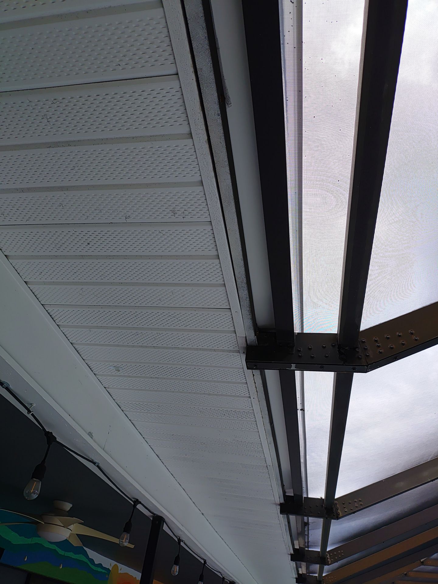 3x4 Downspouts Bronze Installation in Cape Coral FL by Gutter Professors