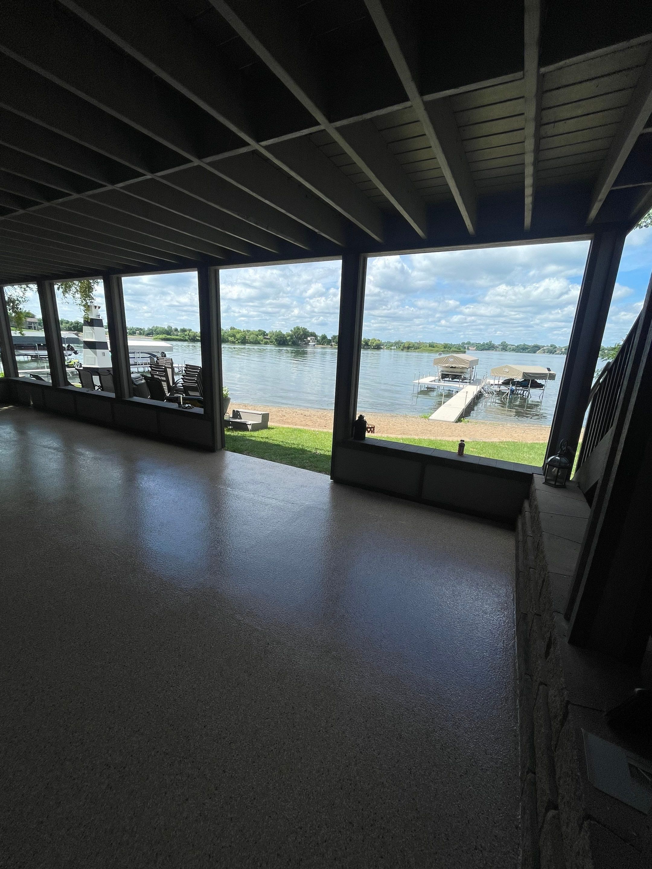 Lakefront Screened Patio Concrete Coating Installation in Wentworth by Select Painting, Coatings & Garage Cabinets