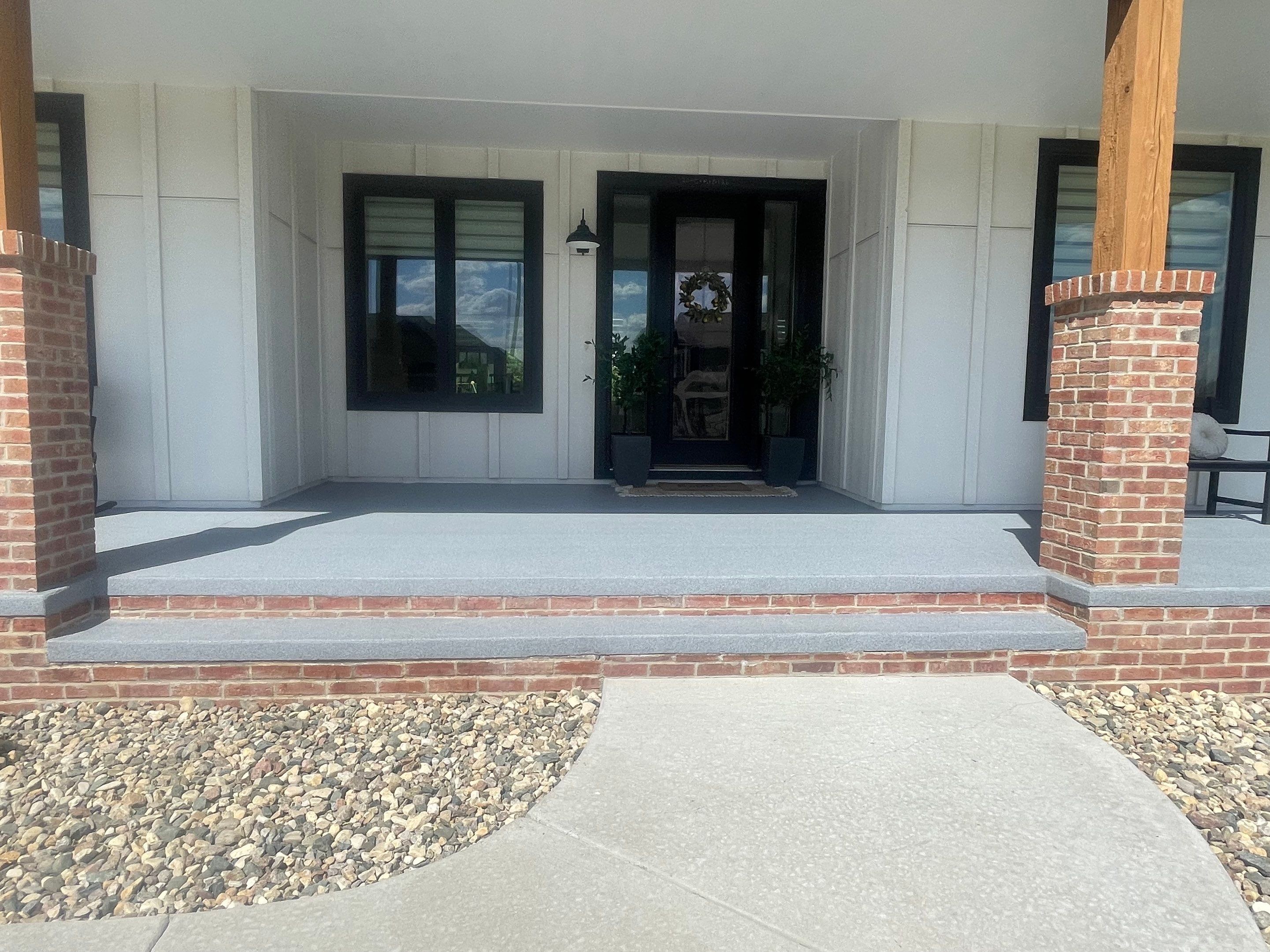 Grey Speckled Concrete Porch Coating for Sioux Falls Home by Select Painting, Coatings & Garage Cabinets