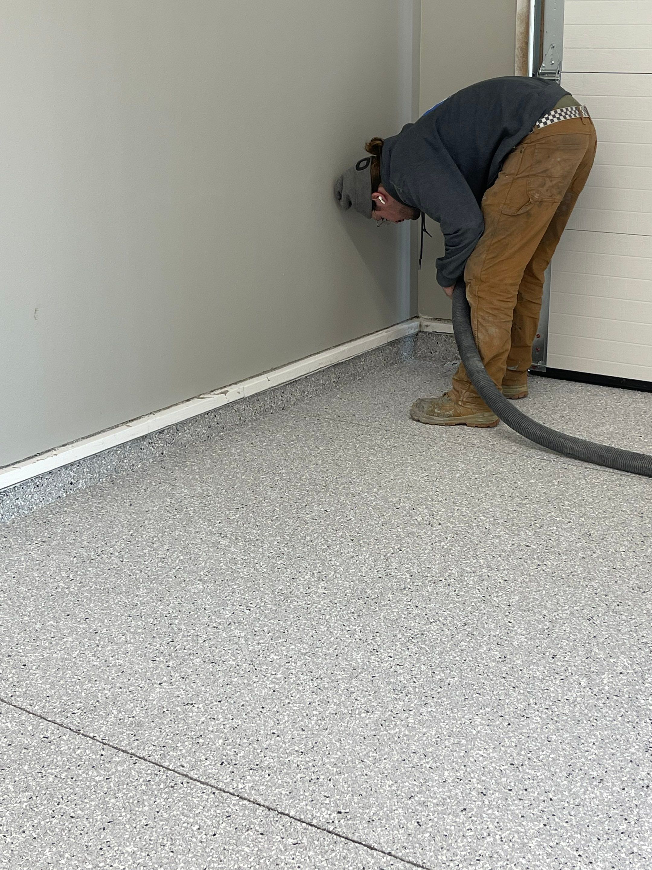 Decorative Flake Concrete Coating Installation in North Sioux City by Select Painting, Coatings & Garage Cabinets
