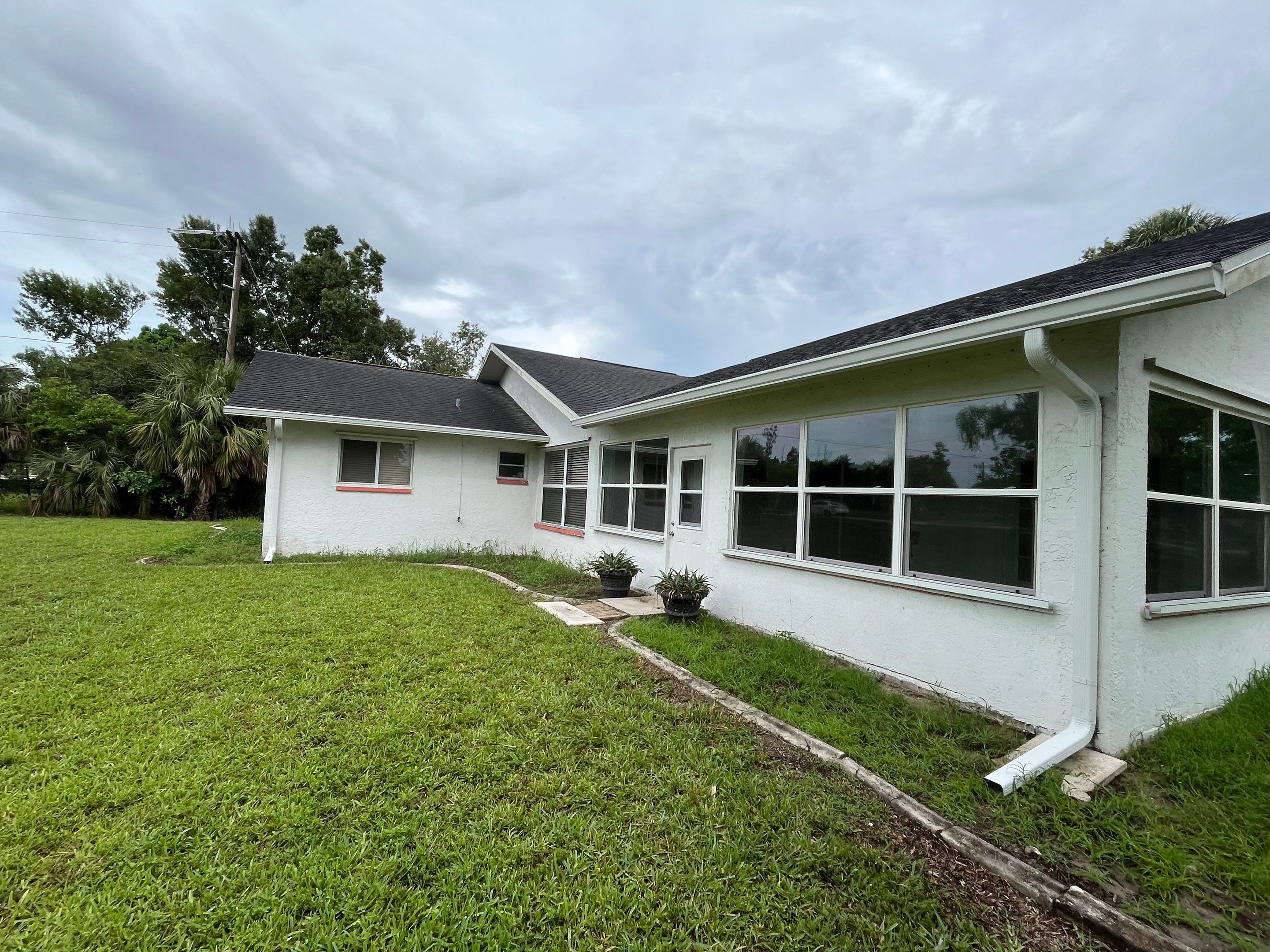 White Seamless Gutters with Splash Guards in North Fort Myers FL by Gutter Professor   by Gutter Professors