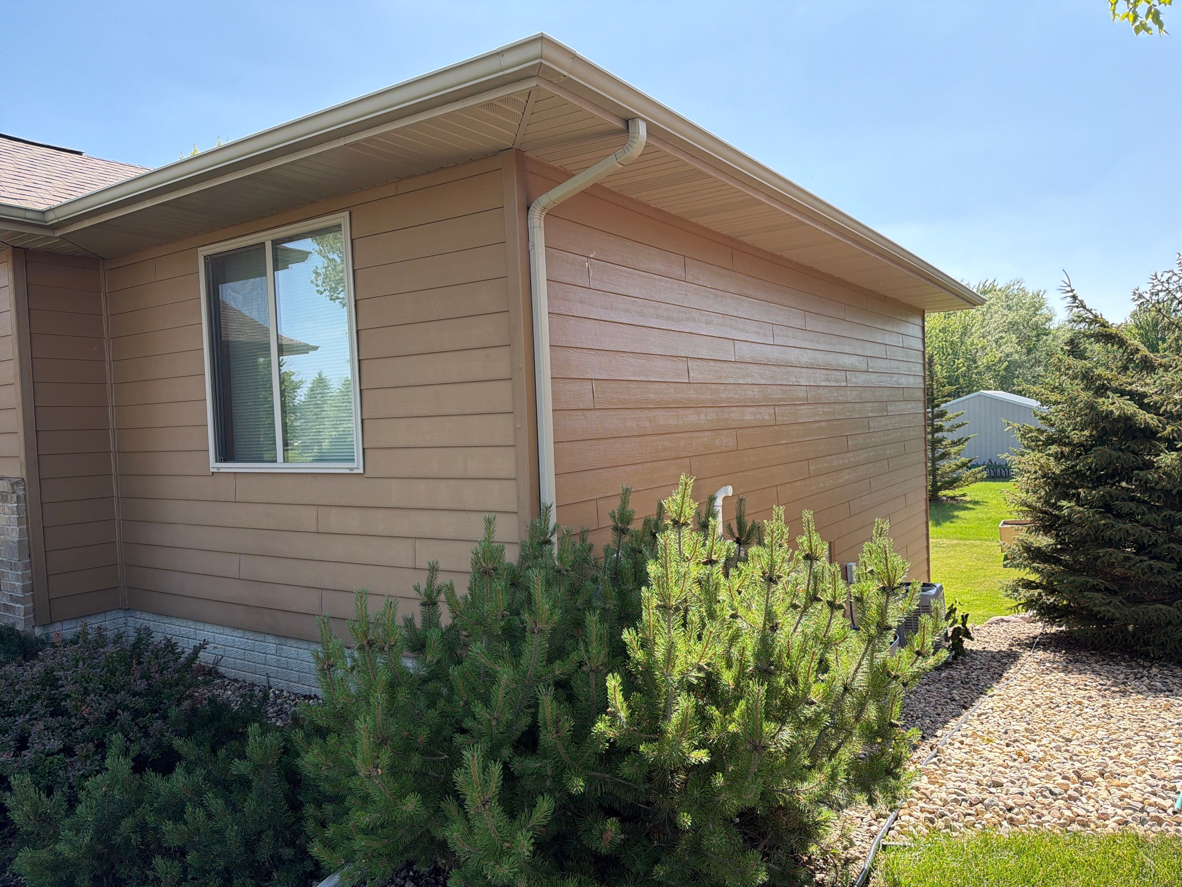 Full Exterior Residential Painting and Siding Refresh in Tea by Select Painting, Coatings & Garage Cabinets