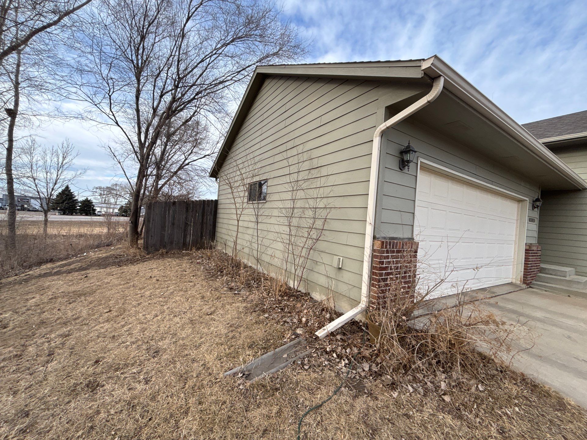 Full Exterior Residential Painting and Siding Refresh in Sioux Falls by Select Painting, Coatings & Garage Cabinets