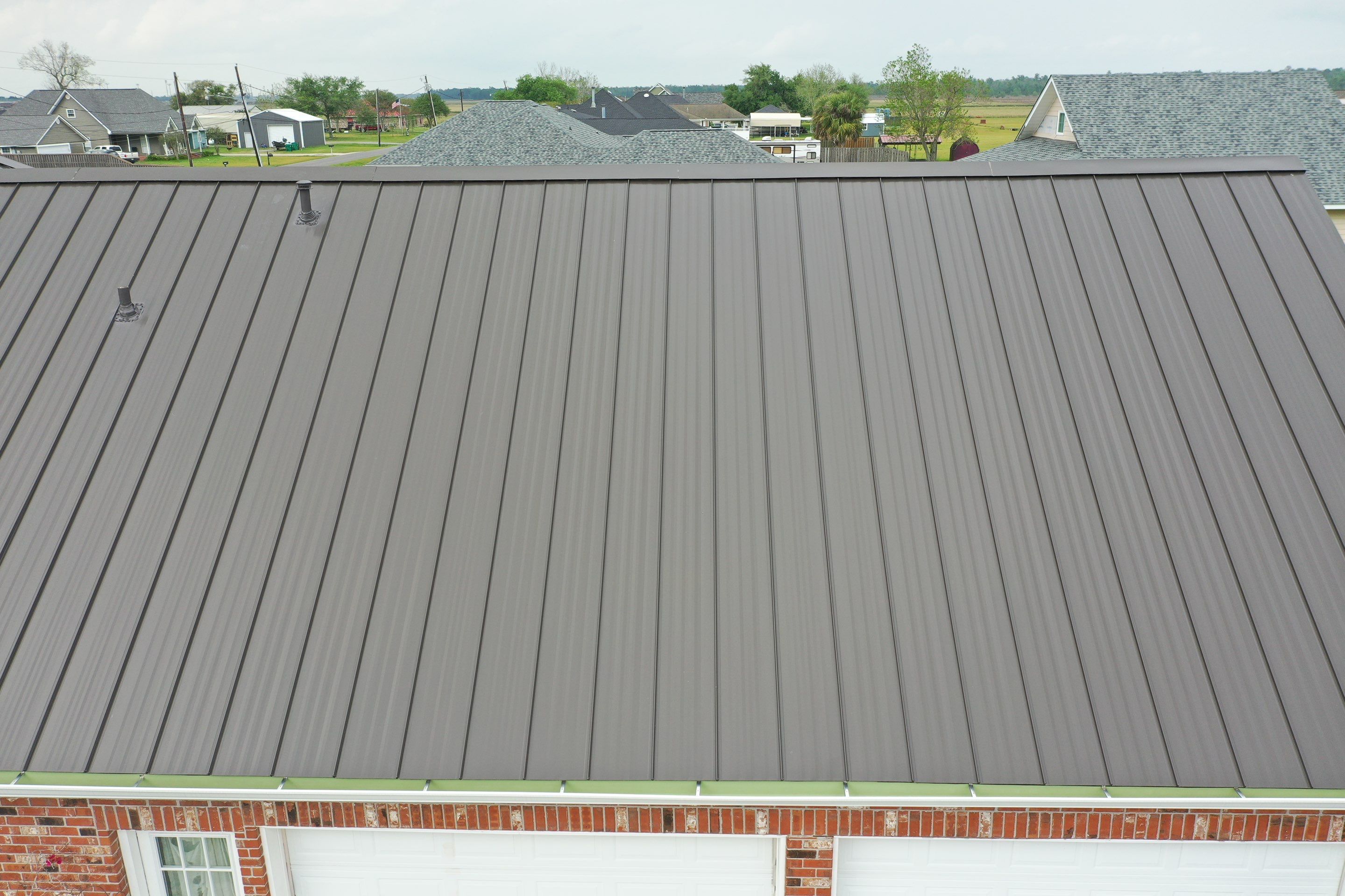 Standing Seam Metal Roof Installation by Top Team Construction