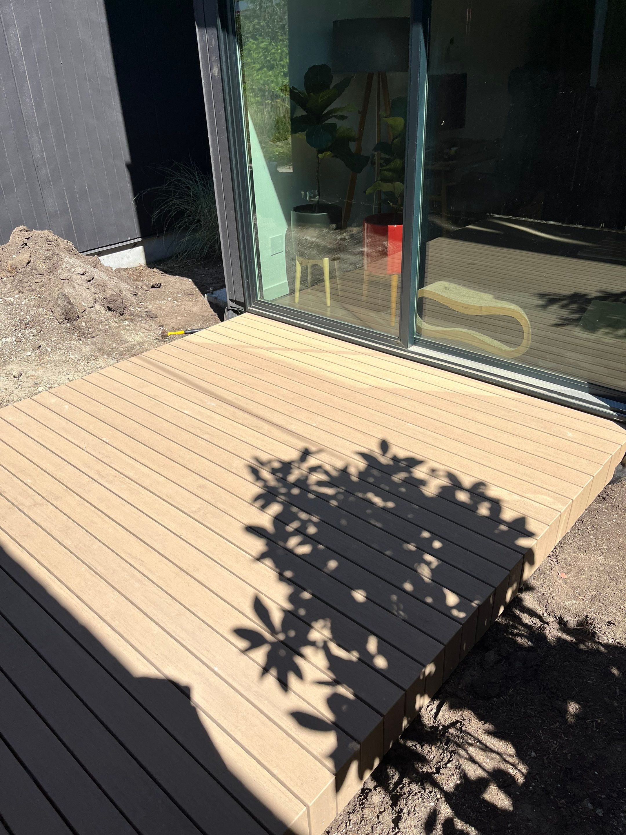 Modern Backyard Deck by Alki deck builders 