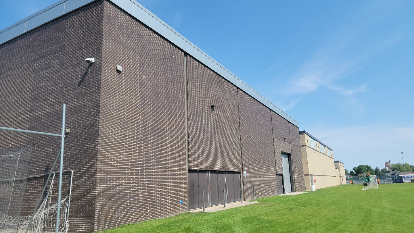 commercial pressure washing using Algaecide, soft wash soap by Northern Power Washing LLC.