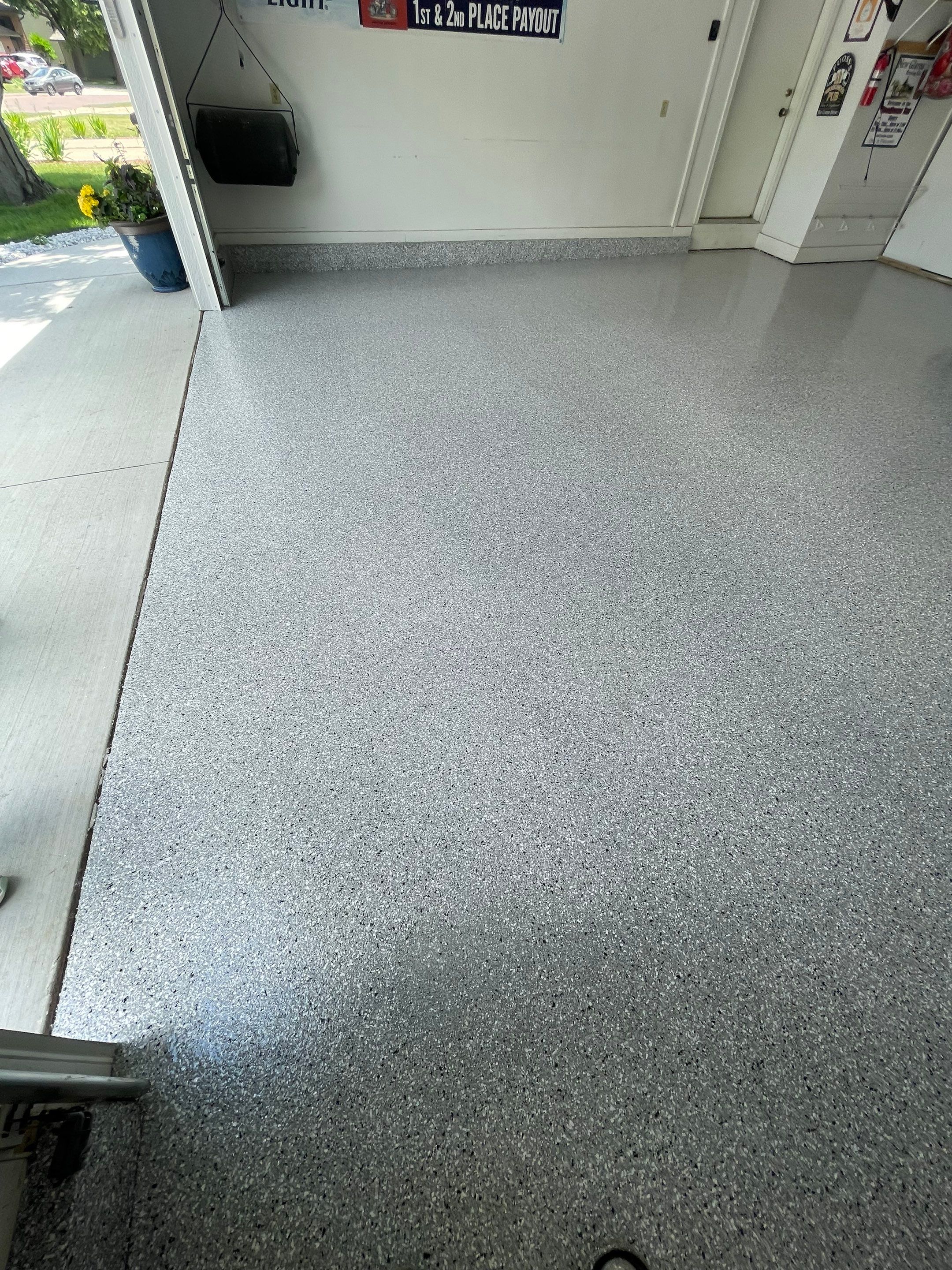 Residential Garage Floor Coating with Feather Grey Finish in Sioux Falls by Select Painting, Coatings & Garage Cabinets