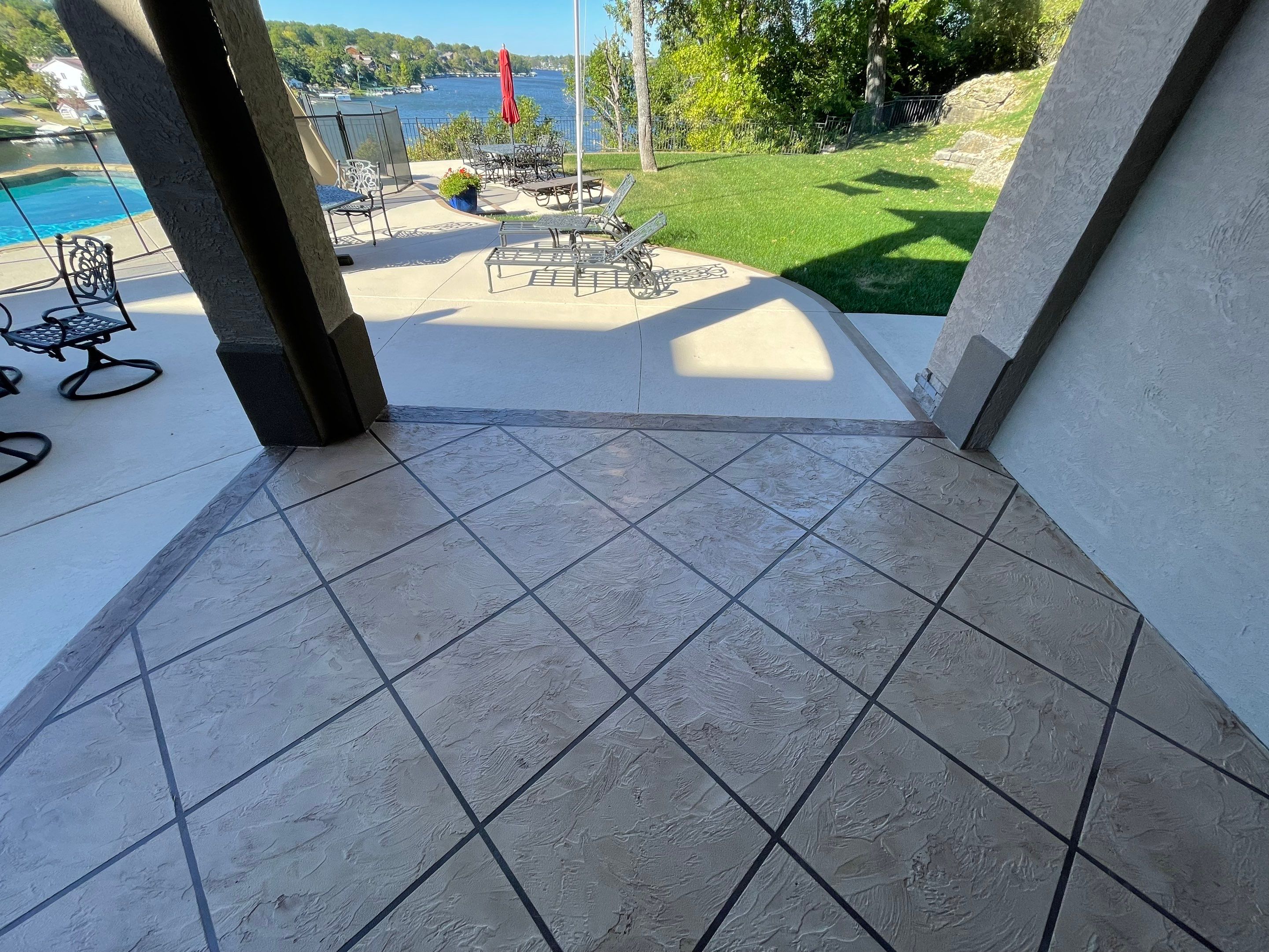 Lake Lotawana -- Front Walkway and Back Patio Tuscan Overlay by Big Red Decorative Concrete, LLC