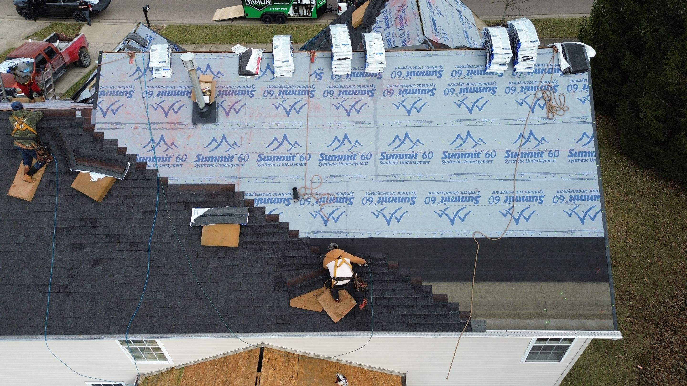 Walden Ponds - Pristine Black and Hydro Flo Gutter Guards by Tamlin Roofing