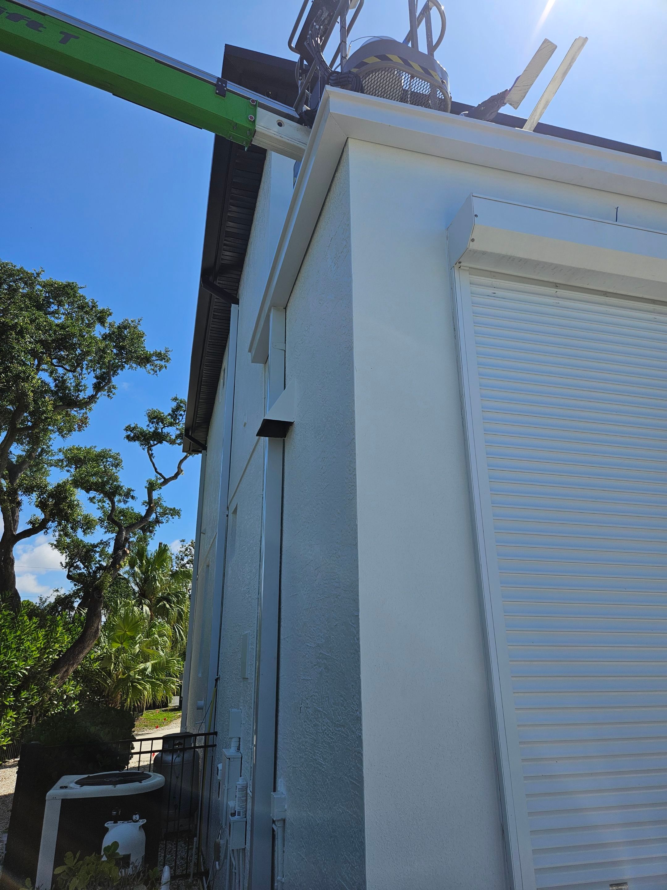 Soffit and Fascia Installation and black seamless gutters in Sarasota FL by Gutter Professors