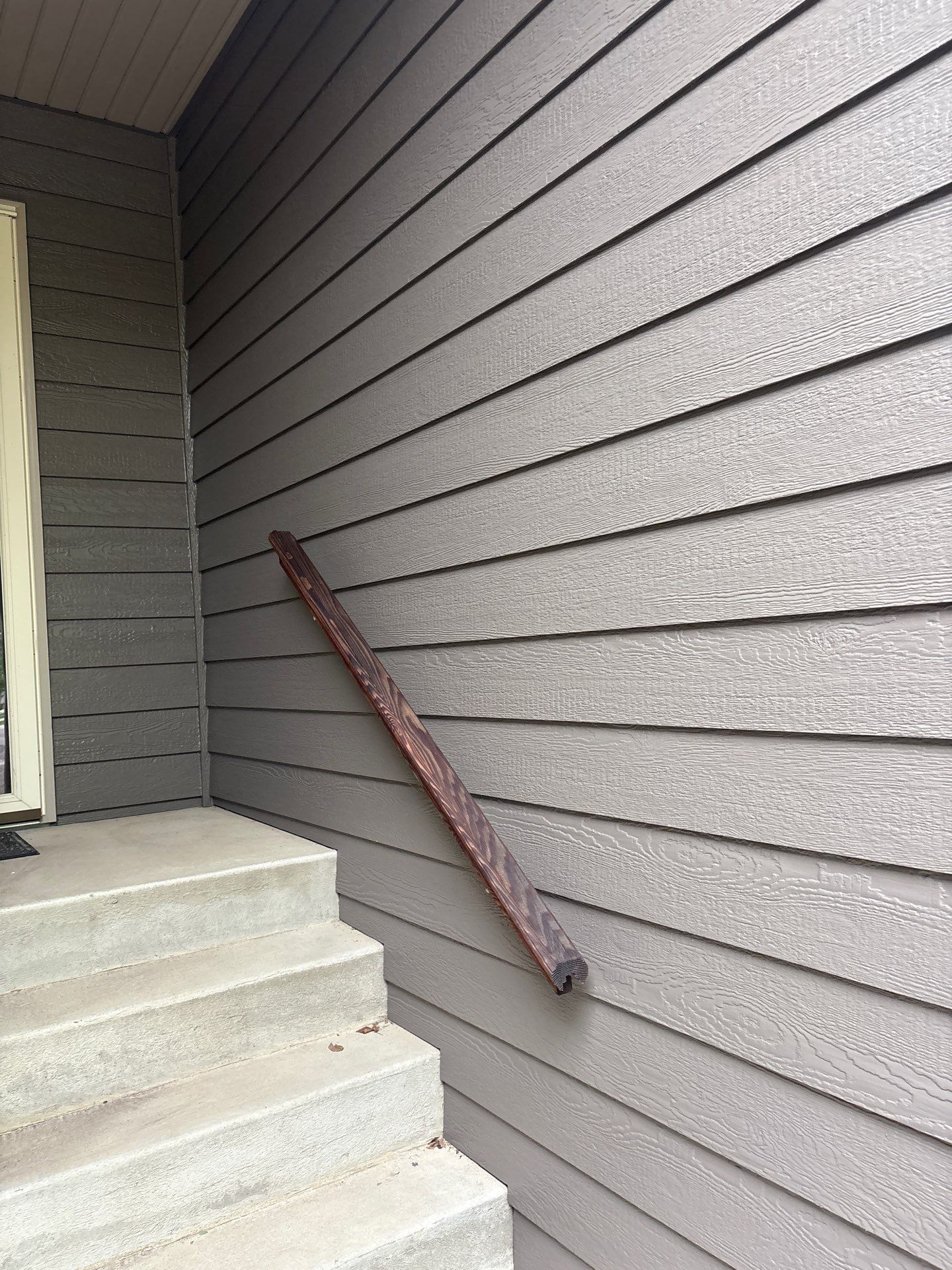 Sioux Falls Residential Exterior Update and Flagstone Pool Deck by Select Painting, Coatings & Garage Cabinets