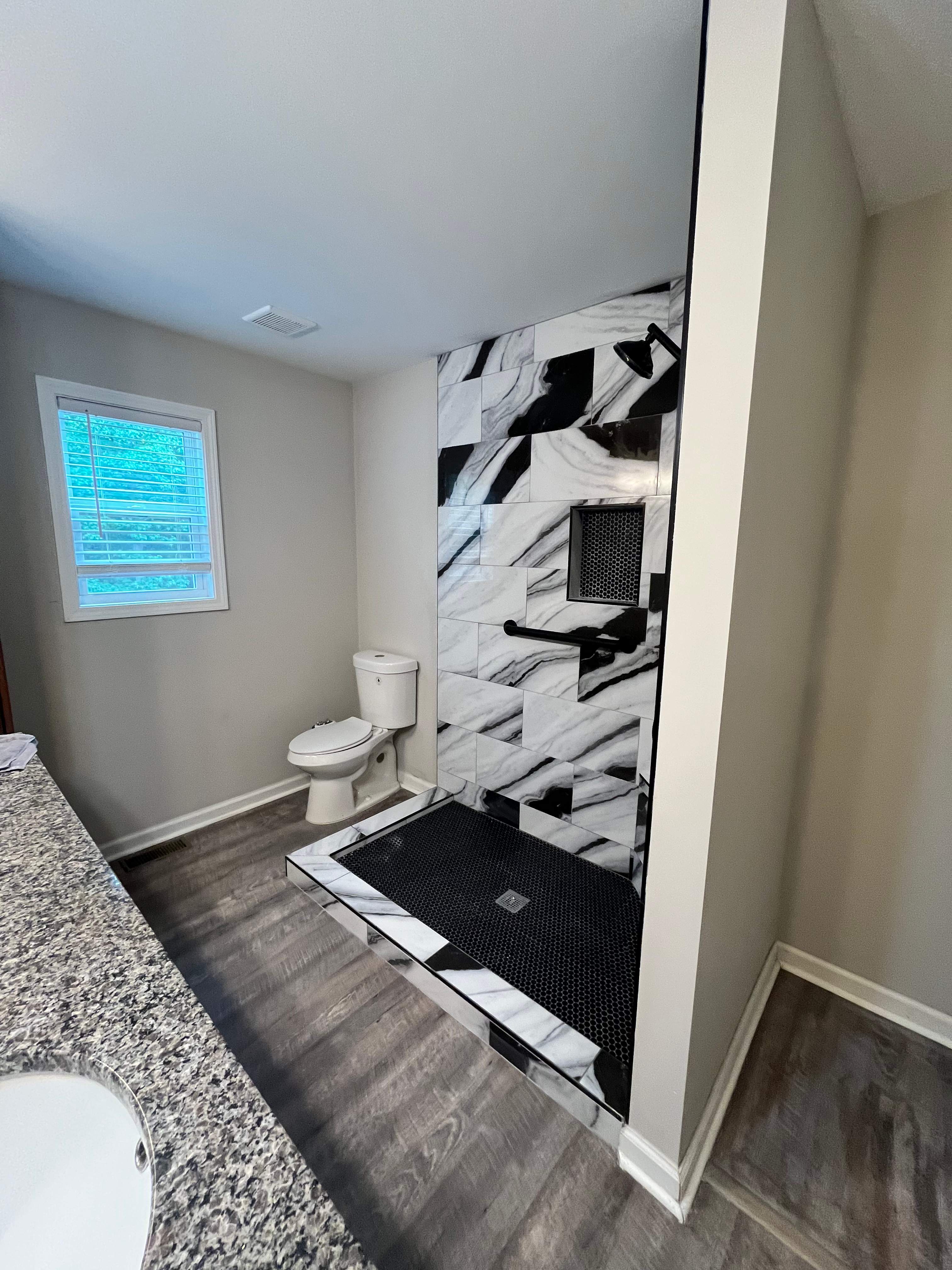 Tub to walk-in shower conversion by Prudencio