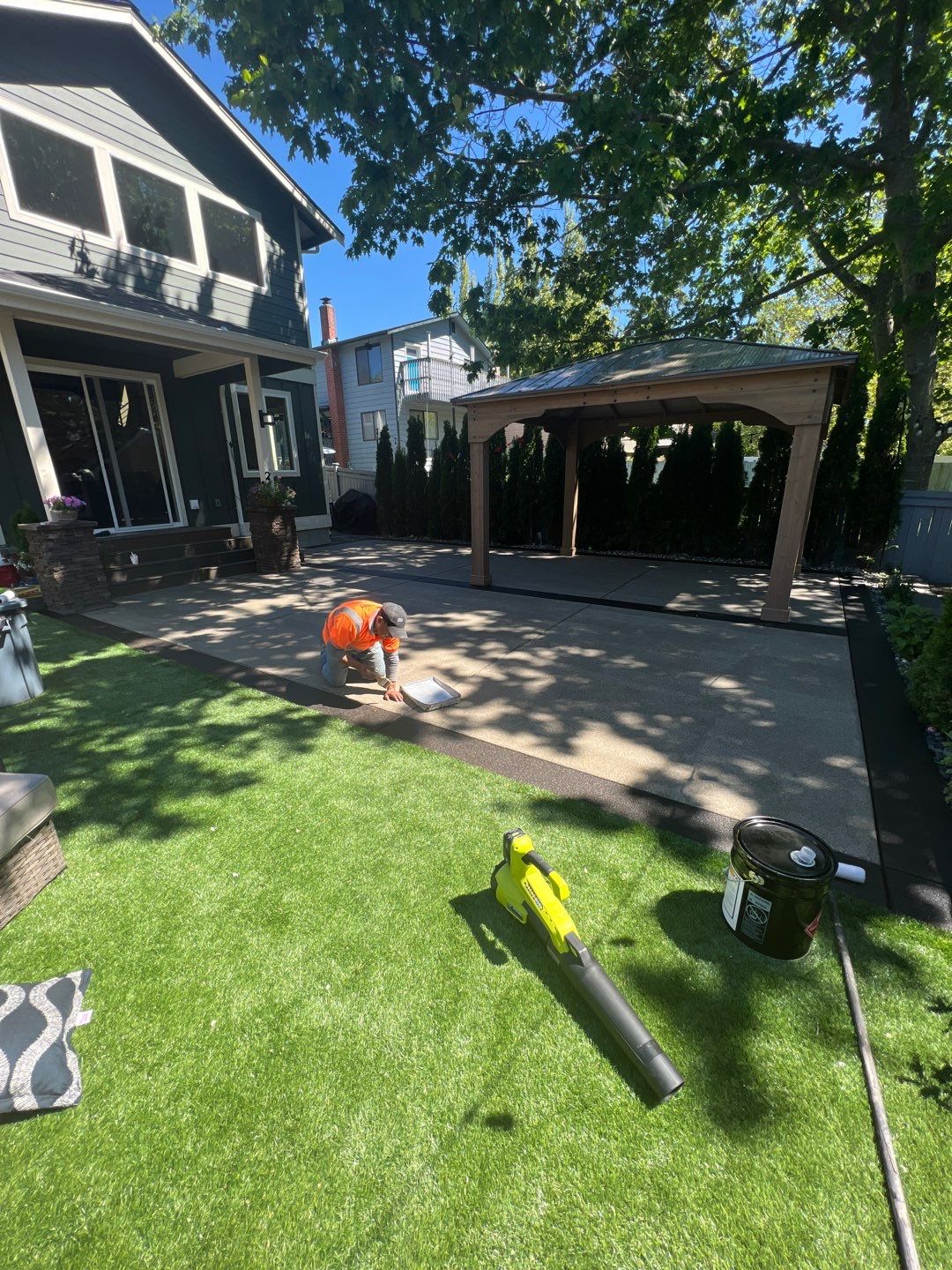 Patio Installation using Concrete, Retaining walls, and Turf install by Jireh Asphalt & Concrete Inc 