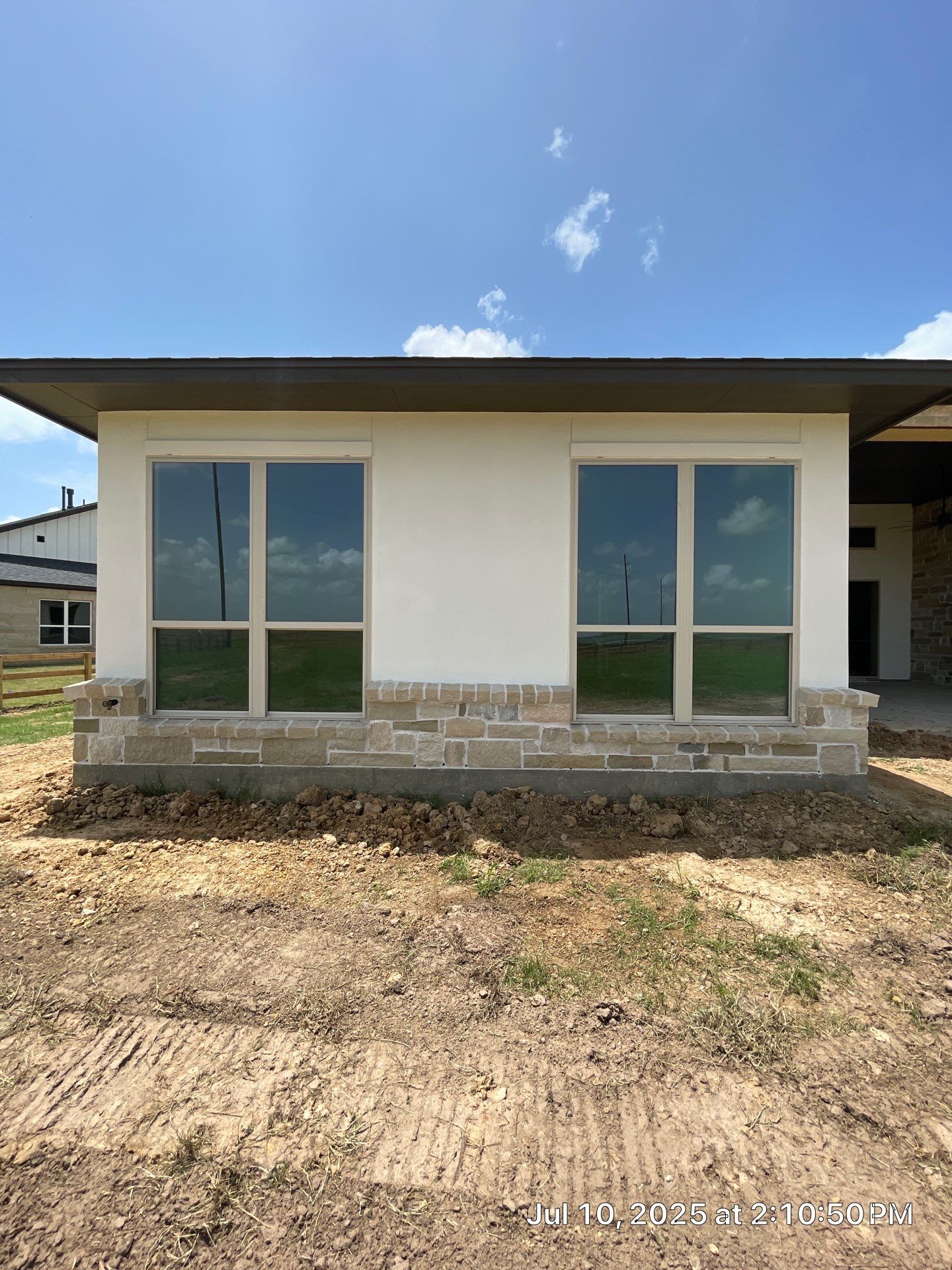 Waller Estate Elegance: Apex Stucco with Grand Stone Accents by Apex Conventional Stucco Llc