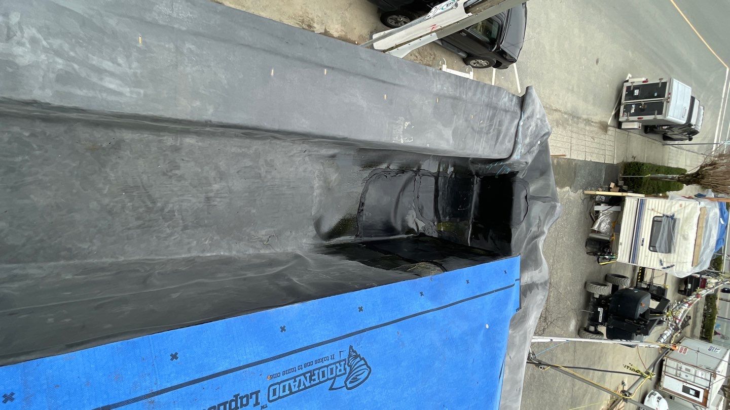 Commercial Roofing Installation using 12" Prolok metal and hidden gutters! by Top Notch Roofing Inc