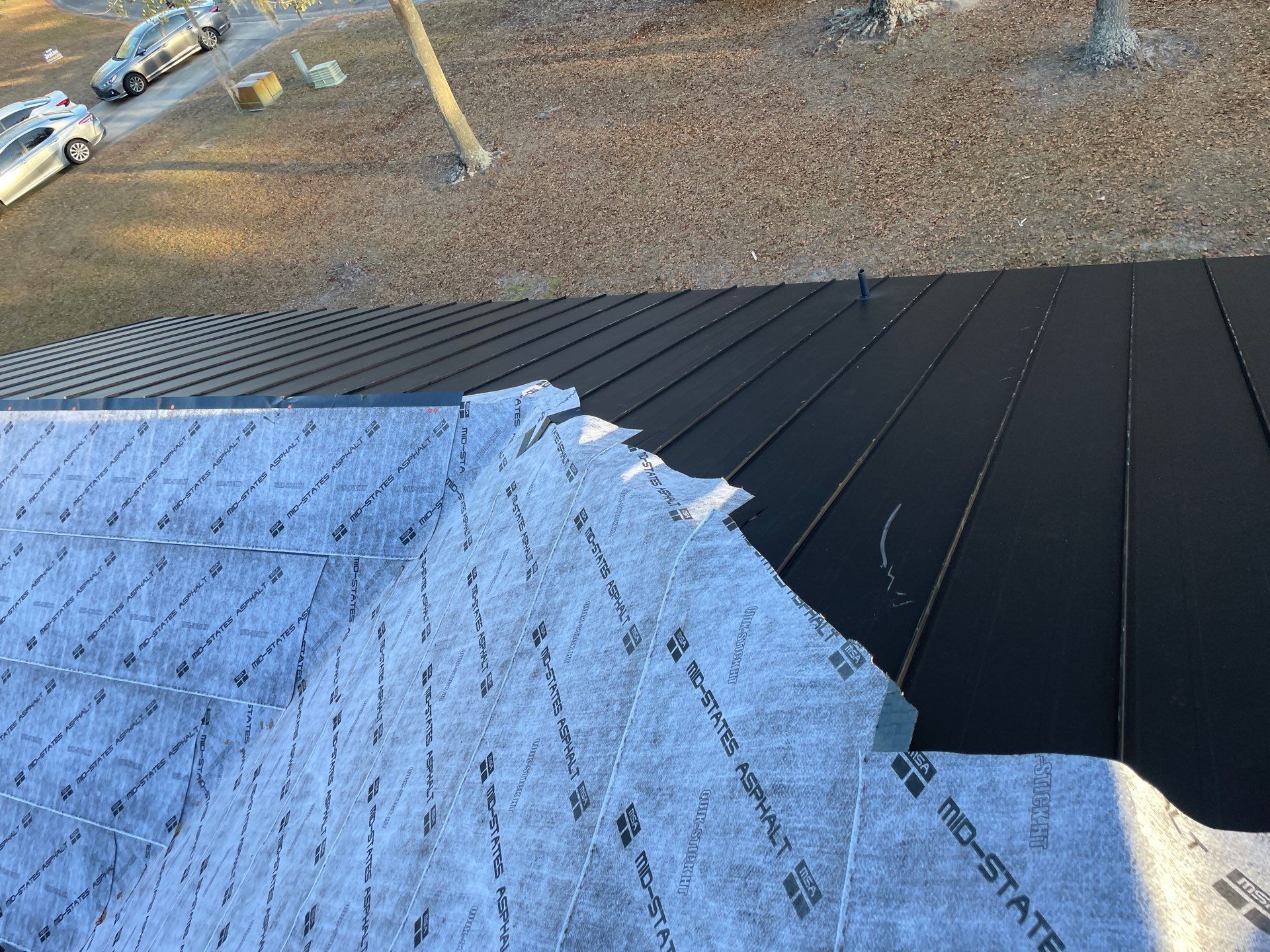 Residential Roofing Installation using Benton 26Ga 1inc Snapcock Metal Roof KYNAR Matte Black by Talya Roofing