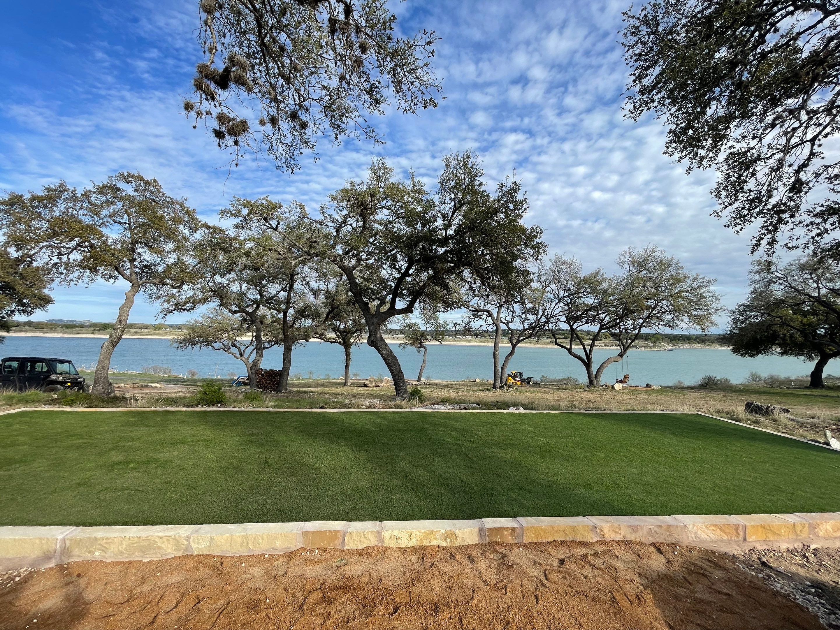 Lakeside Firepit and Turf Area by Singer Services