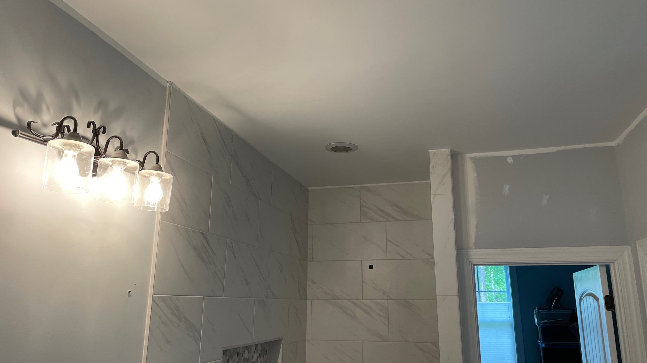 Bright Bathroom Remodel with Wall Removal, Stand Alone Tub and New Vanity by Footprints Floors of Coastal Carolina