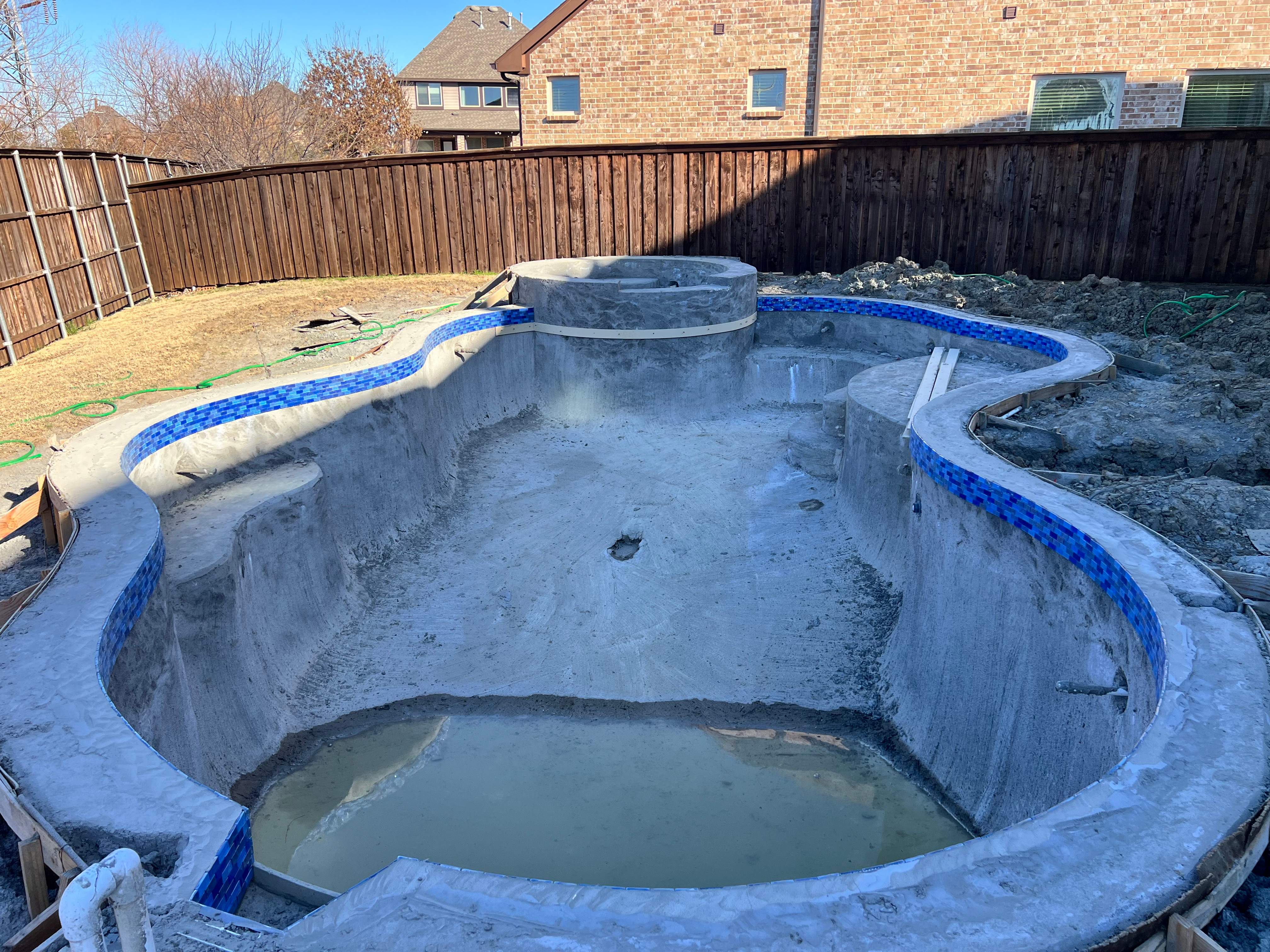 Freeform Pool and Spa with Pergola and Outdoor Kitchen by Pinnacle Pools and Spas - DFW