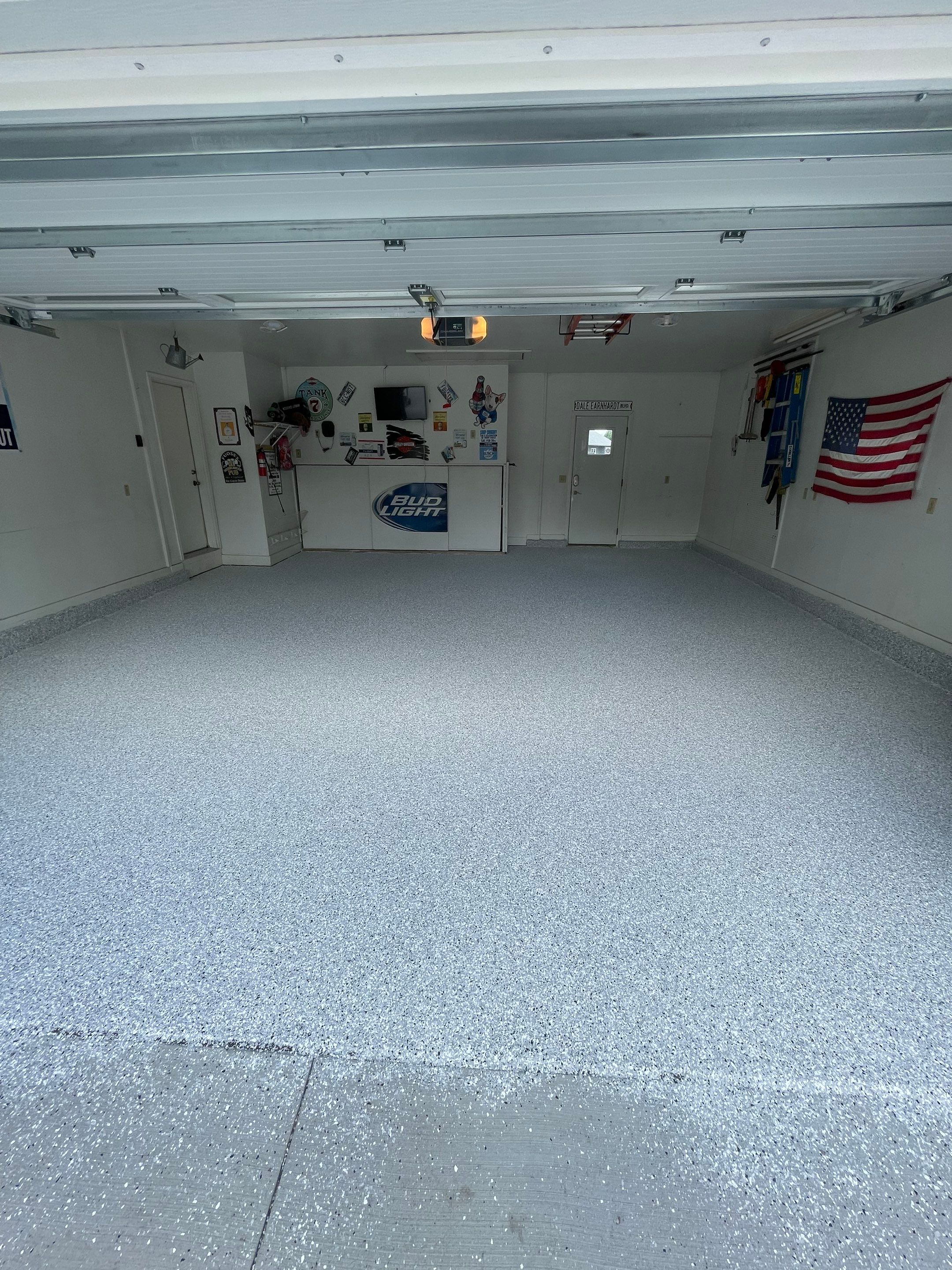 Residential Garage Floor Coating with Feather Grey Finish in Sioux Falls by Select Painting, Coatings & Garage Cabinets