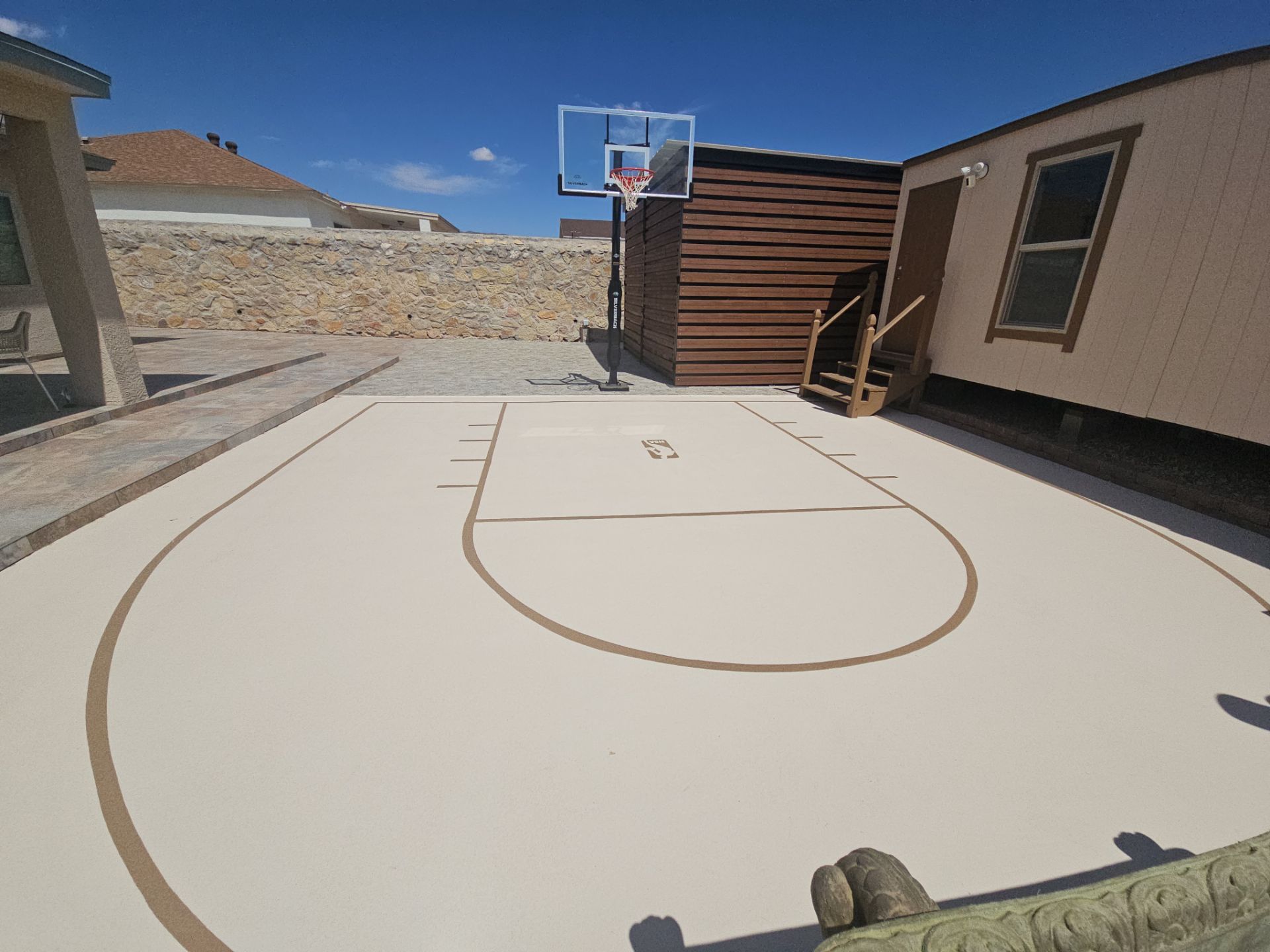 Exterior Building Painting and Repairs with Basketball Court and Playground by Regal Renovate