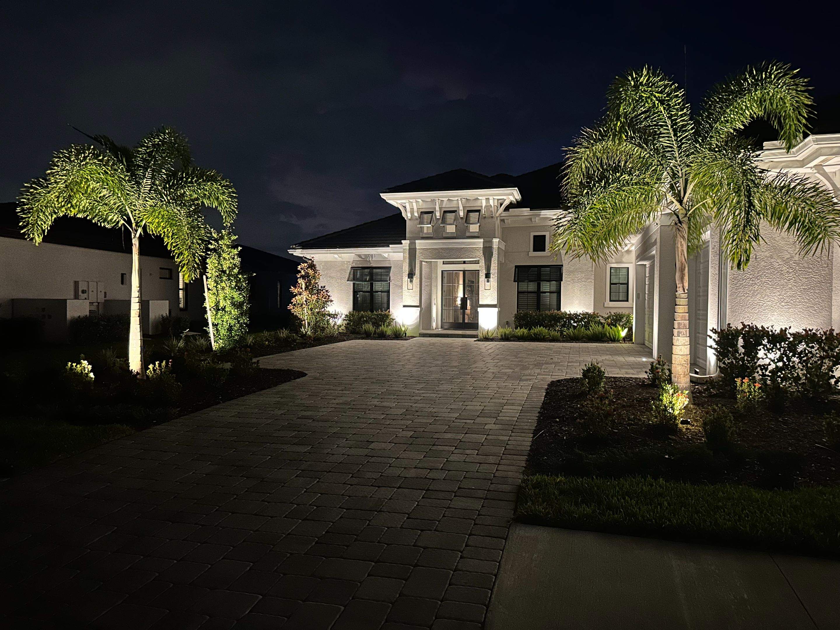 Architectural and Landscape Lighting Installation for Modern Sarasota Home by Illuminate Landscape Designs