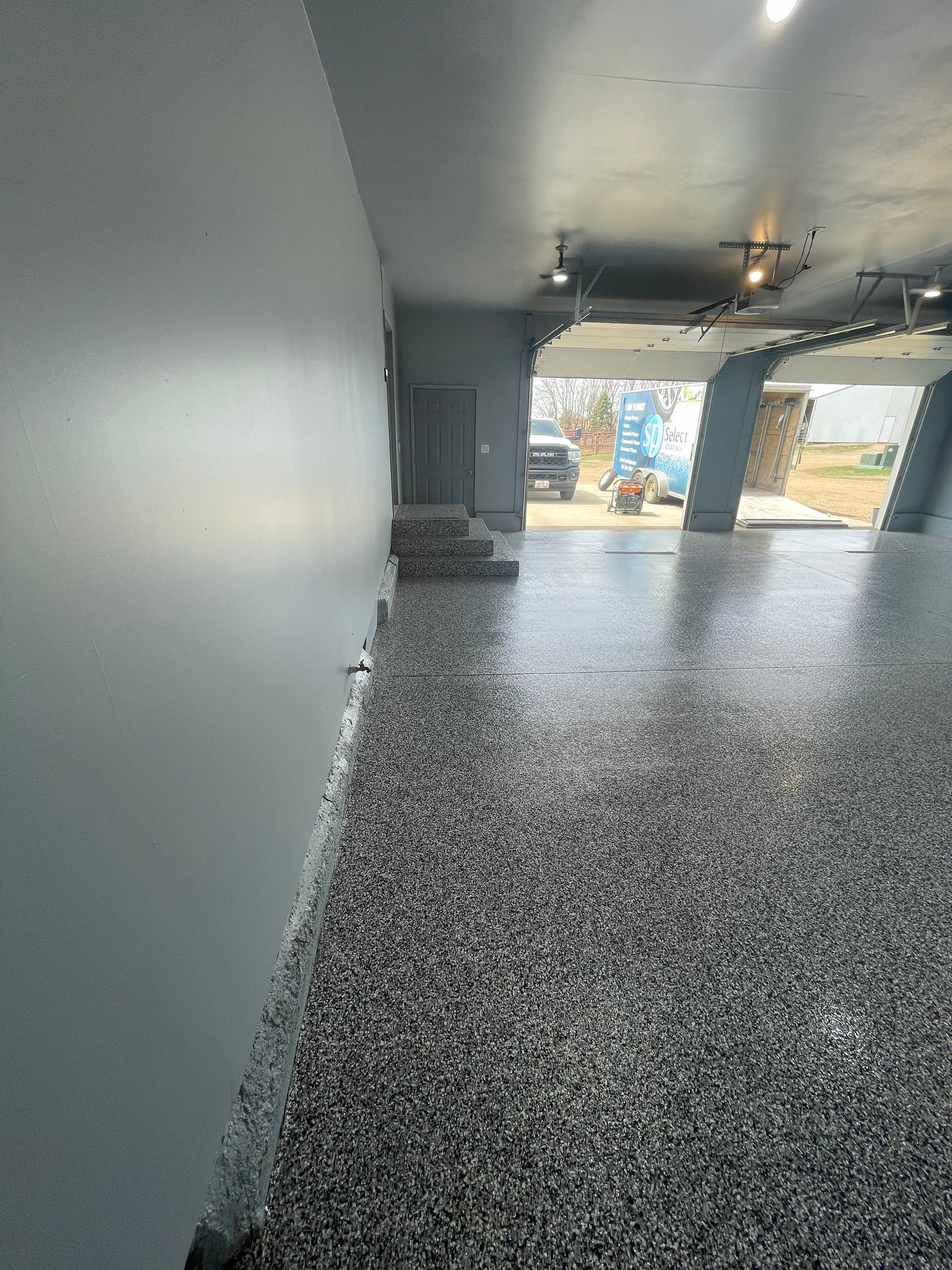 Grey Granite-Style Garage Floor Coating and Stairs in Hartford by Select Painting, Coatings & Garage Cabinets