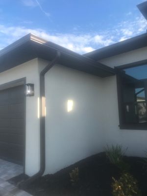 Seamless Gutter Installation using Musket Brown Seamless Gutters in Cape Coral FL