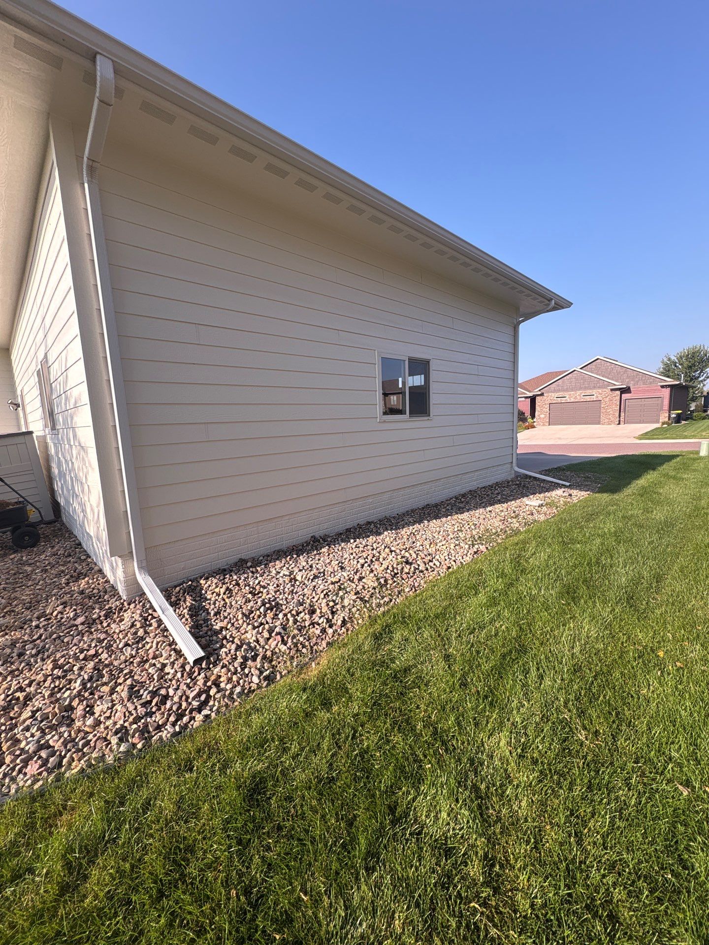 Sioux Falls Exterior Residential Siding and Deck Painting Project by Select Painting, Coatings & Garage Cabinets