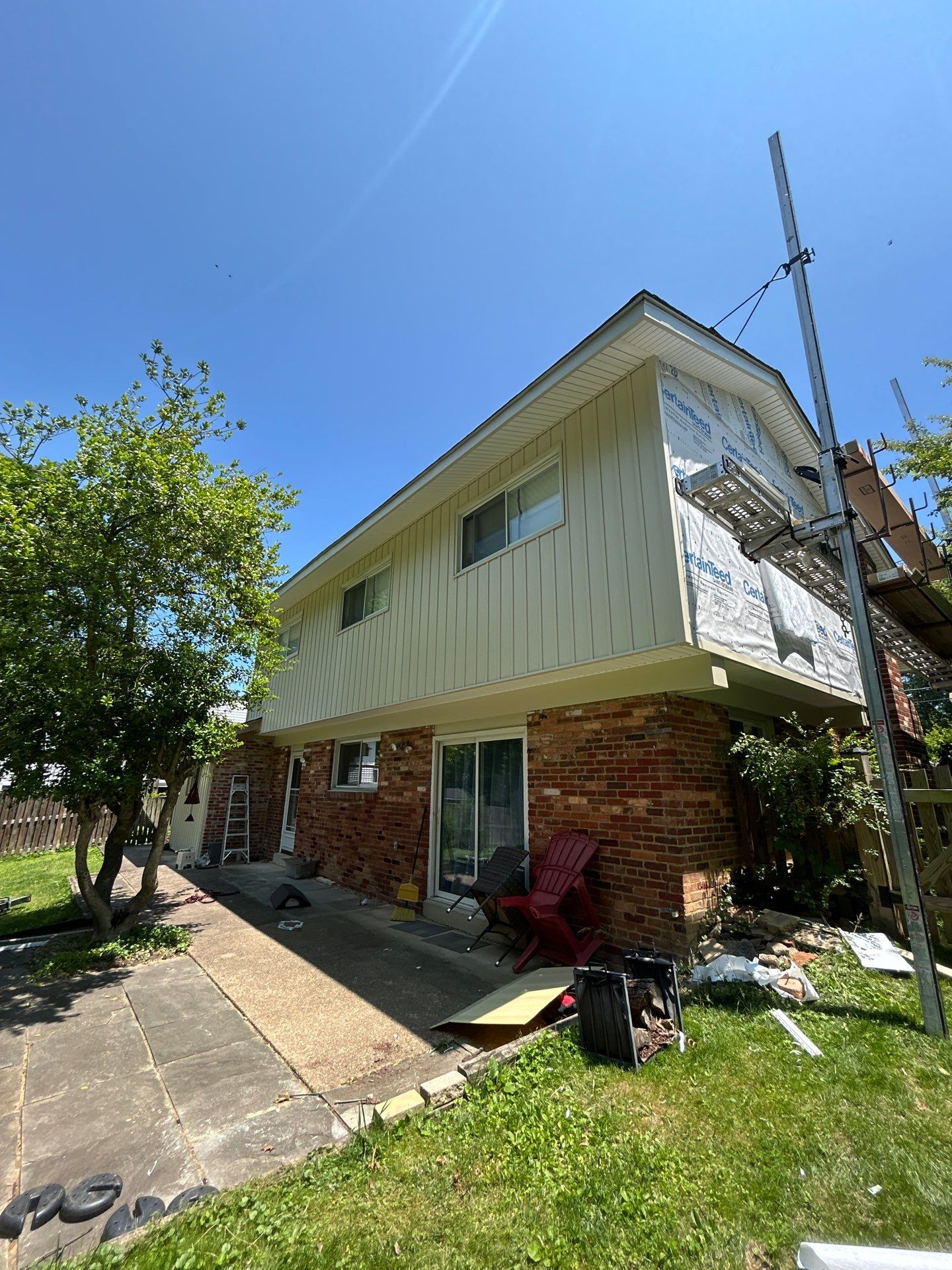Fairfax: Residential Siding Replacement with CertainTeed 8" Board and Batten Siding in Desert Tan by RM Banning, Inc.
