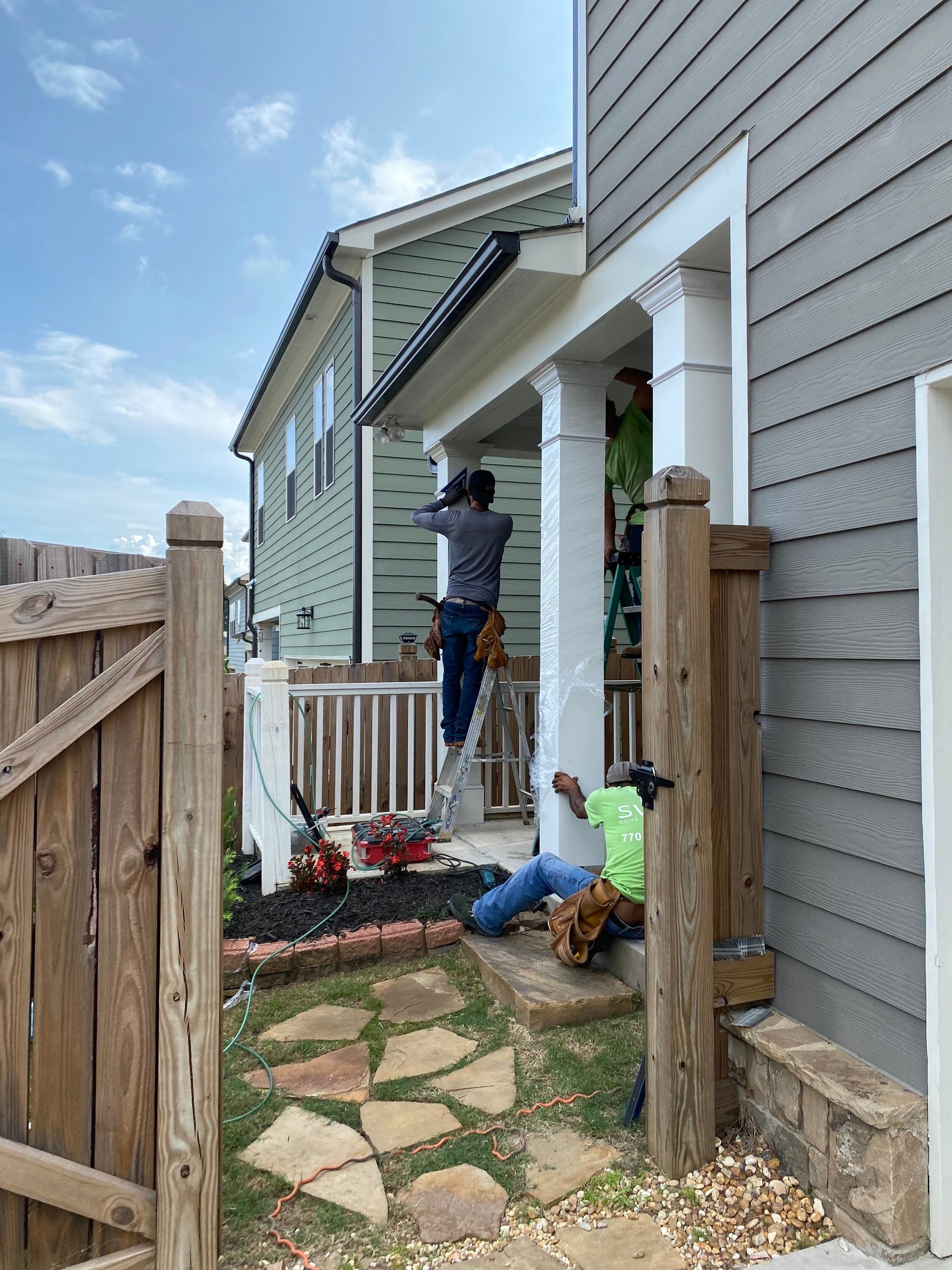 Custom Screened-In Porch Enclosure with White Railings in Smyrna by Swift Home Renovations