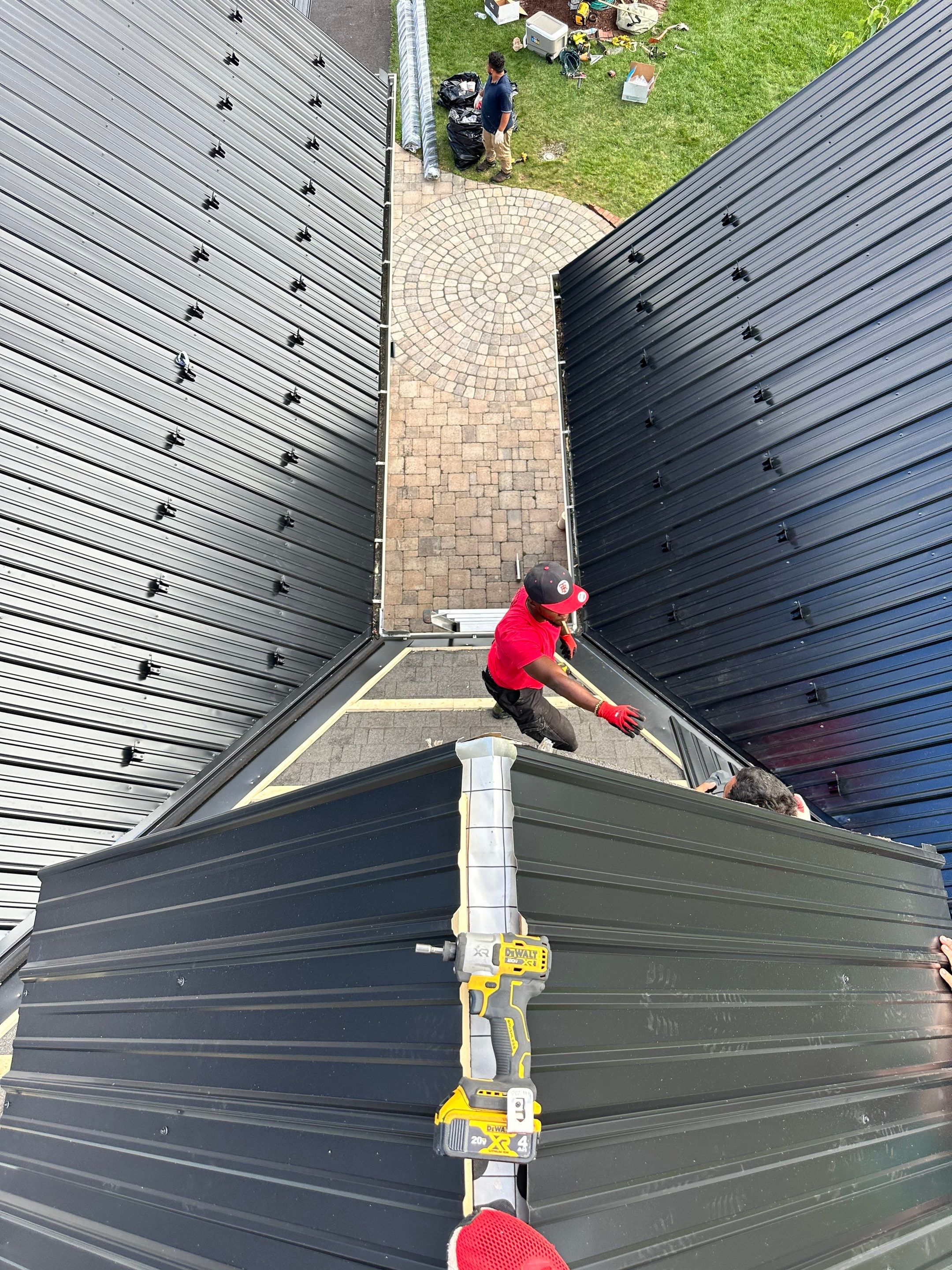 Standing seam / Azm panel in black  by Teflon Roofing