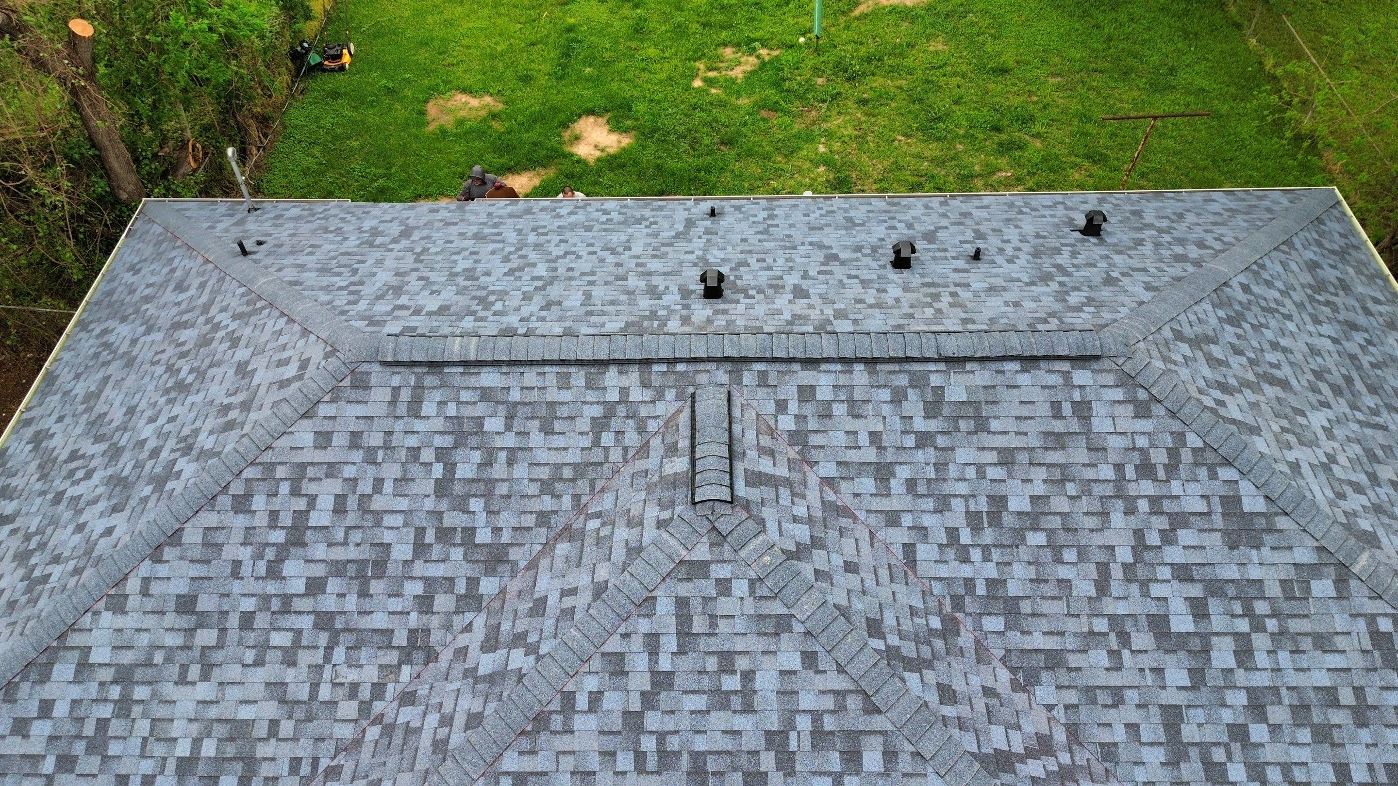 Houston Residential Roof Replacement Using Harbor Blue Architectural Shingles by Houston Roofing & Construction