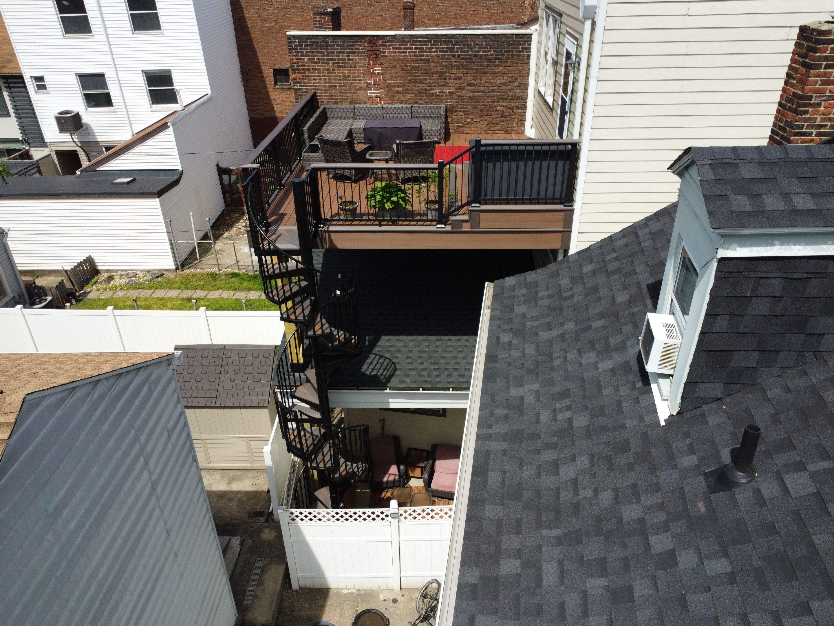Elevated Multi-Level Composite Deck with Spiral Staircase in Pittsburgh by Cousins Roofing Siding & Decks