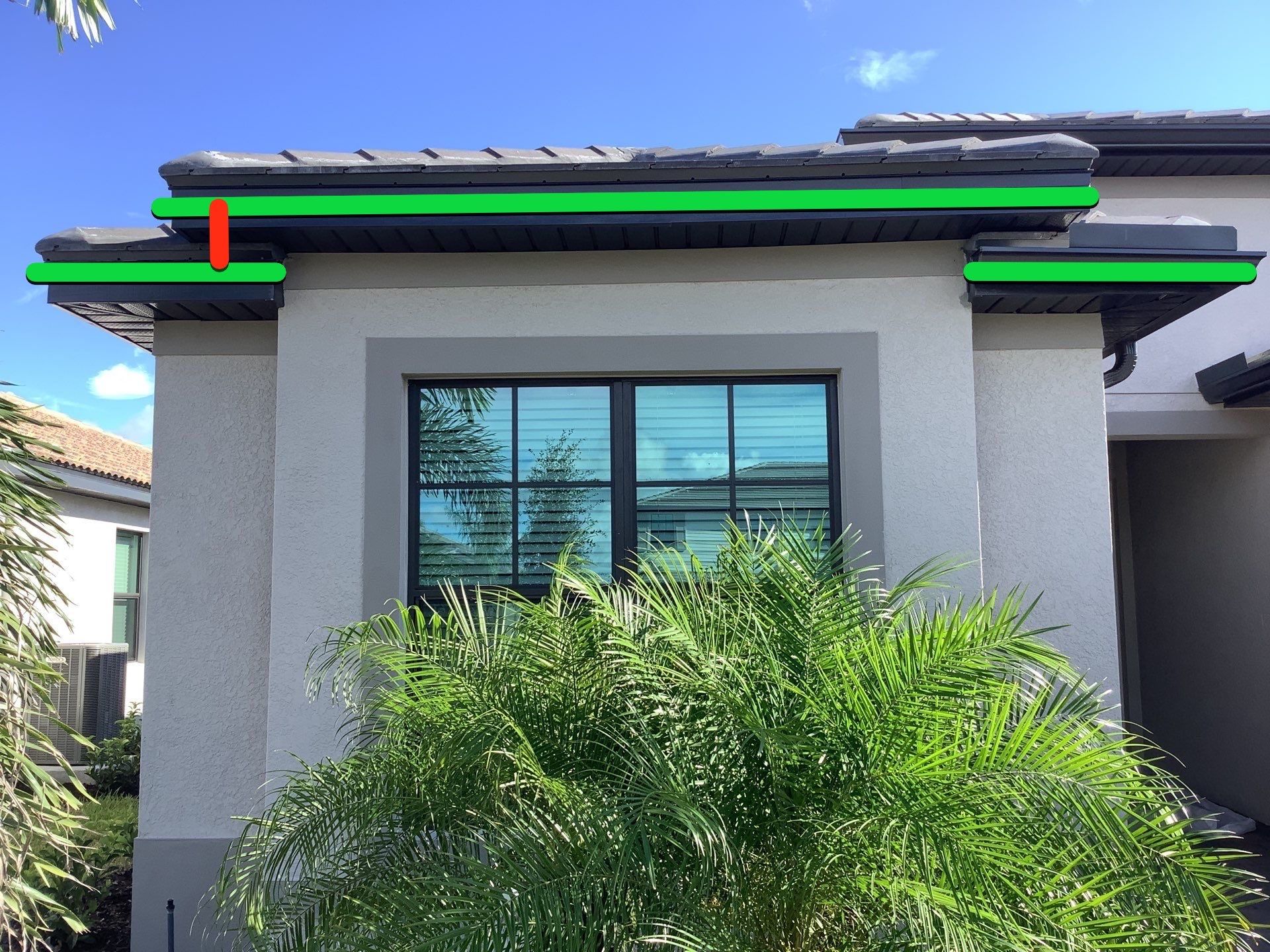 Seamless brown gutter and downspouts installation in Estero, FL  by Gutter Professors