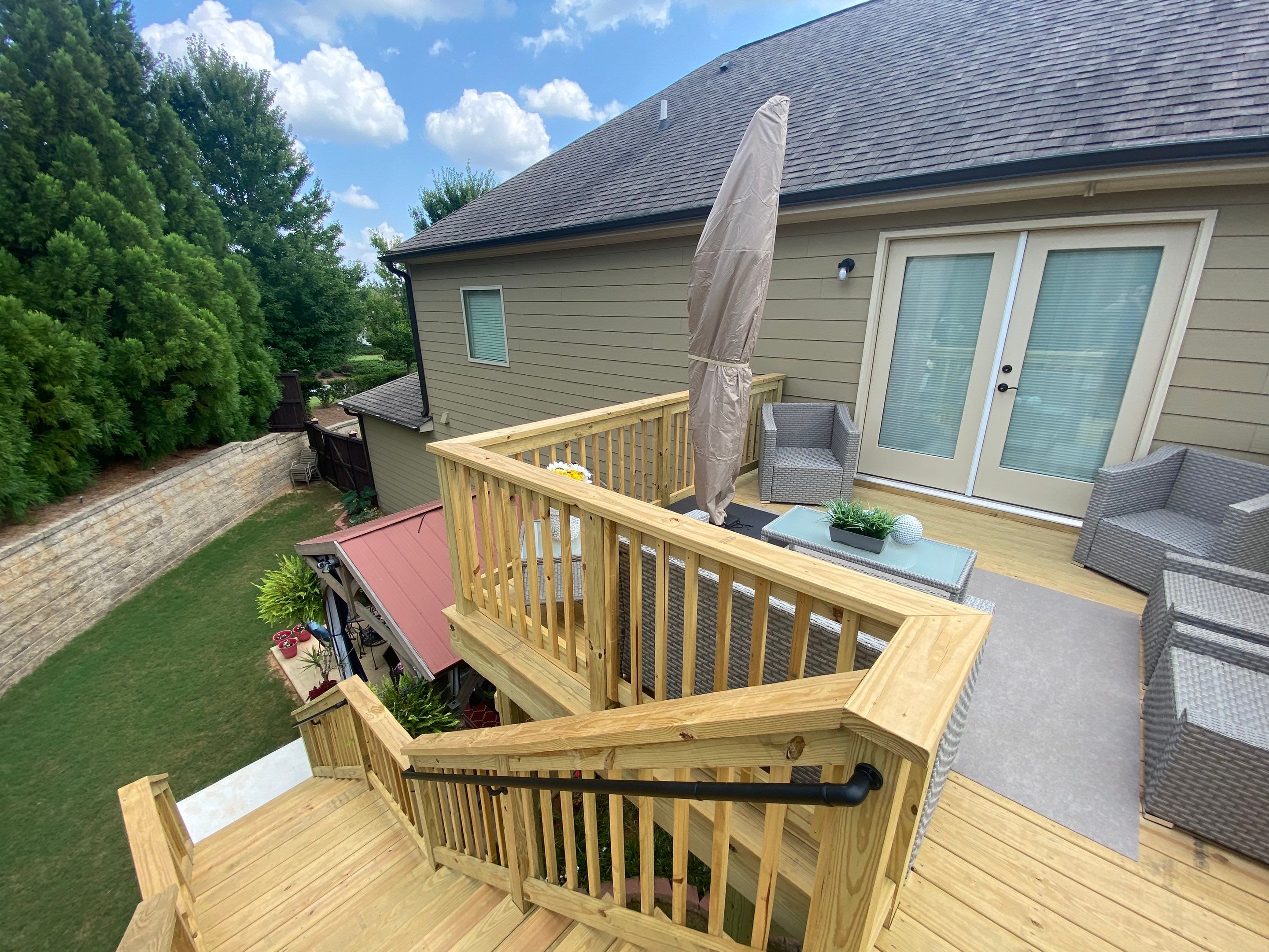 Pressure-Treated Wood Deck and Staircase Construction in Cumming, Georgia by Swift Home Renovations