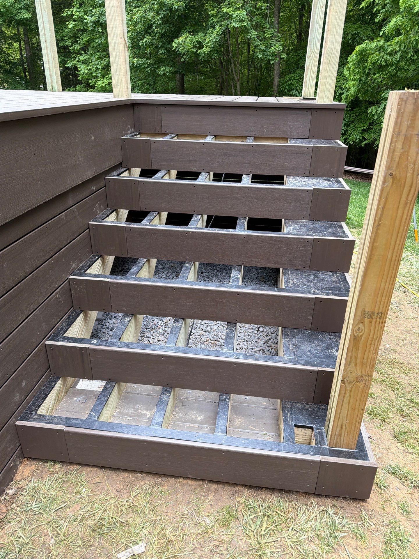 Custom Composite Deck and White Vinyl Railing Installation in Fayetteville by Walnut Hollow Decks & Outdoor Living