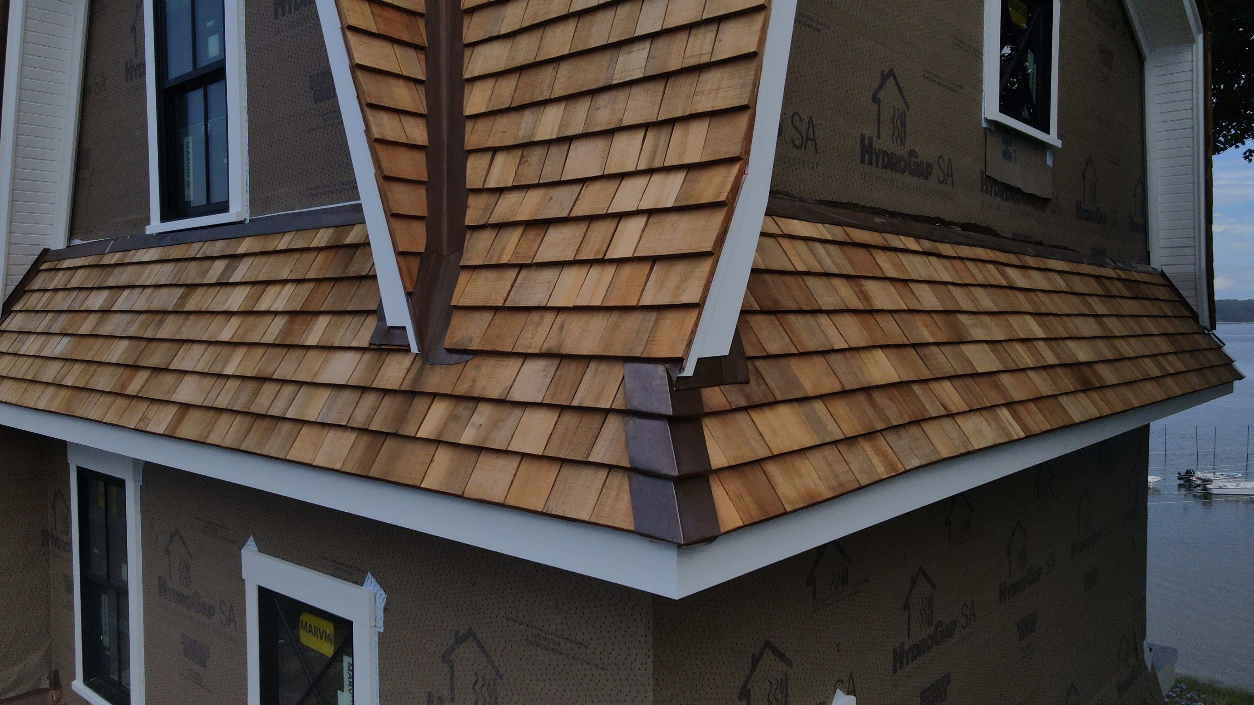 Great Island - Red Cedar Roofing, Yellow Cedar Siding, Standing Seam Copper, & Copper Gutters  by Rinaldi Brothers