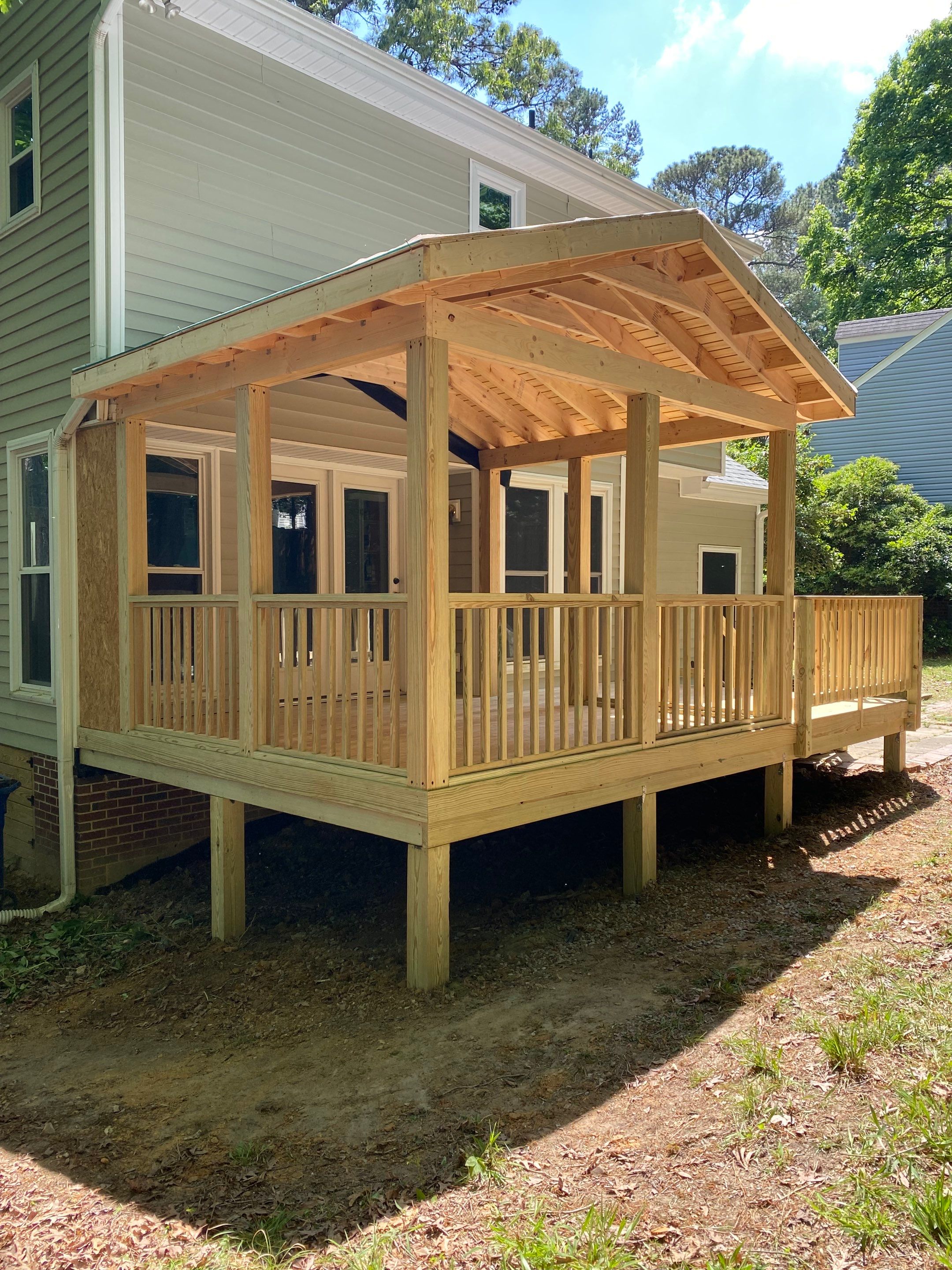 Custom Screen Porch Addition with Gabled Roof and Open Deck by The Remodeling Company