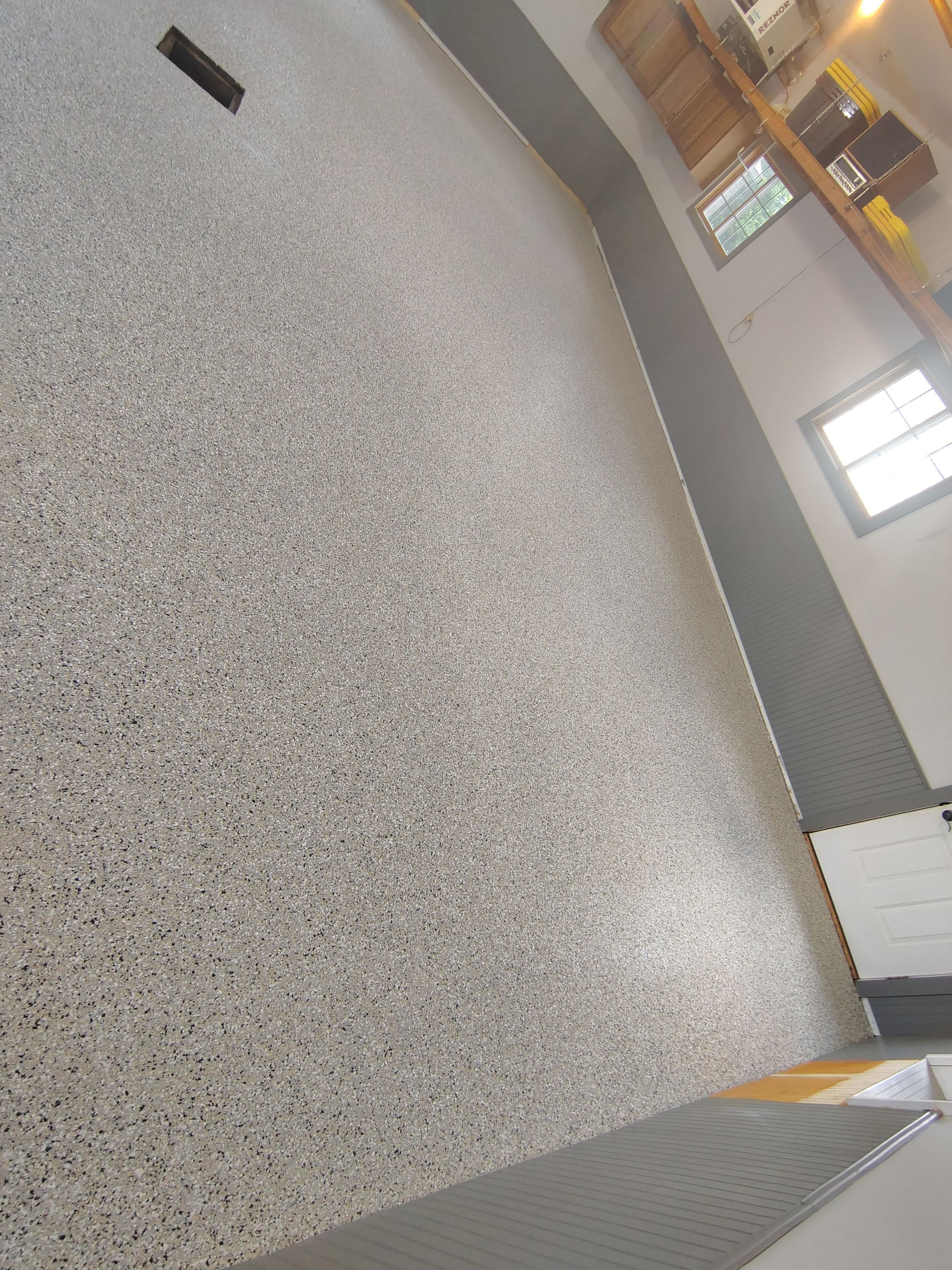 Multi-Fleck Epoxy Garage Floor Coating in Dell Rapids by Select Painting, Coatings & Garage Cabinets