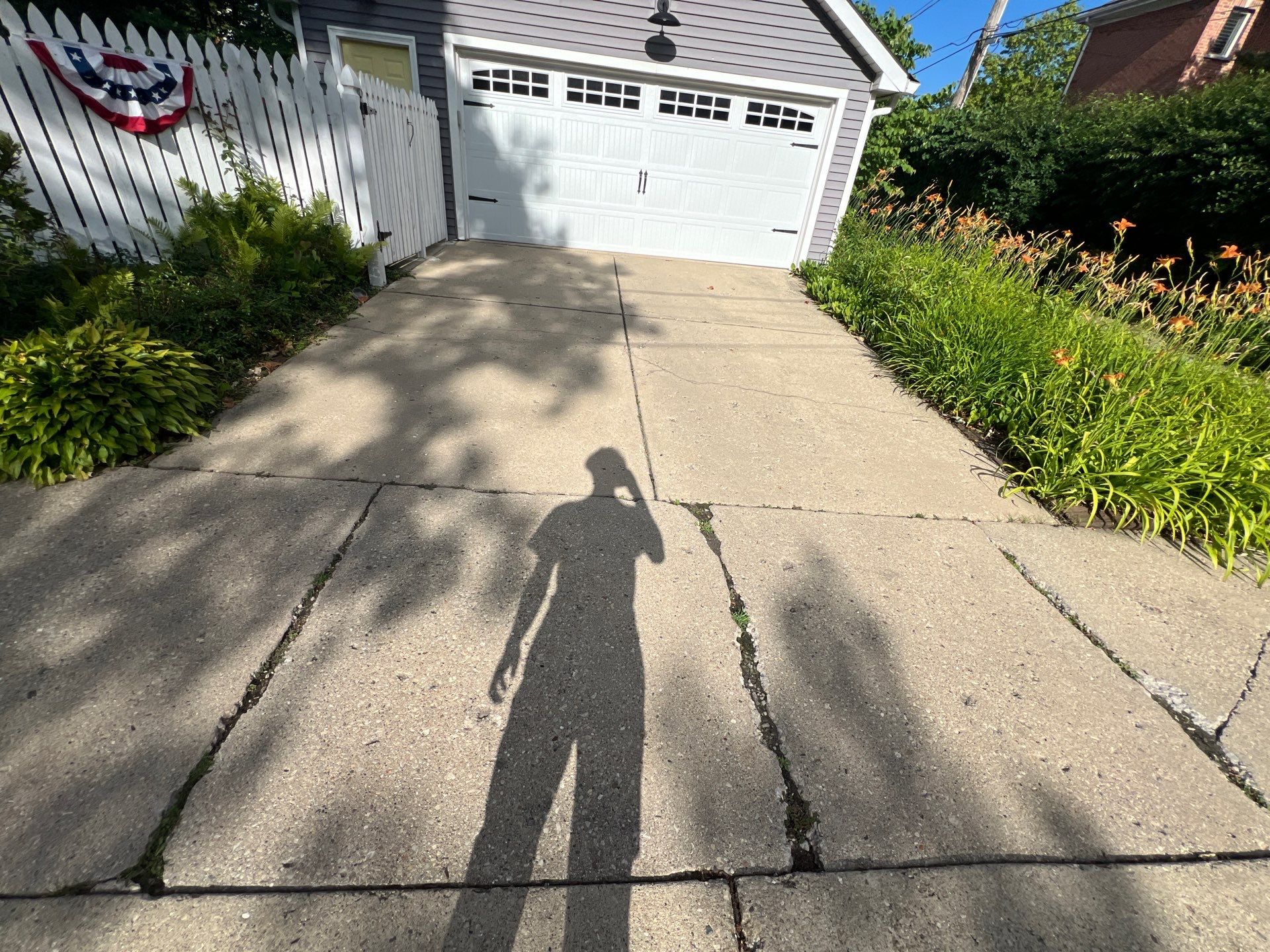 concrete cleaning using Algaecide, soft wash soap by Northern Power Washing LLC.