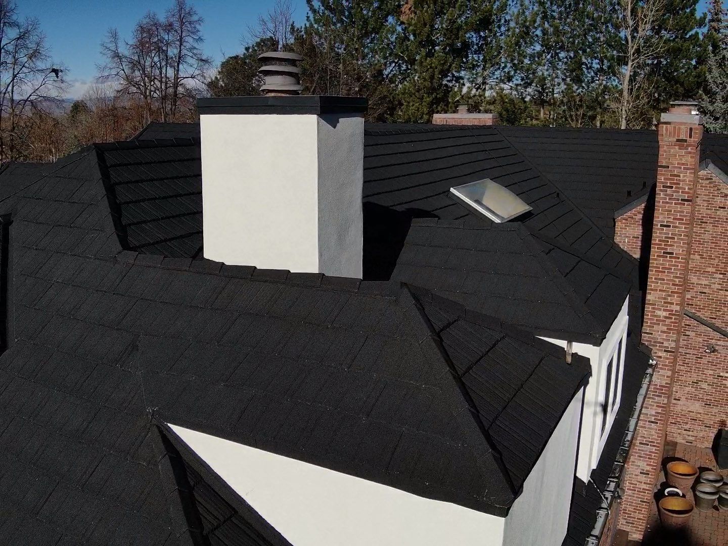 Unified Stone Coated Roof & Stucco Remodle by Blue Peaks Roofing LLC