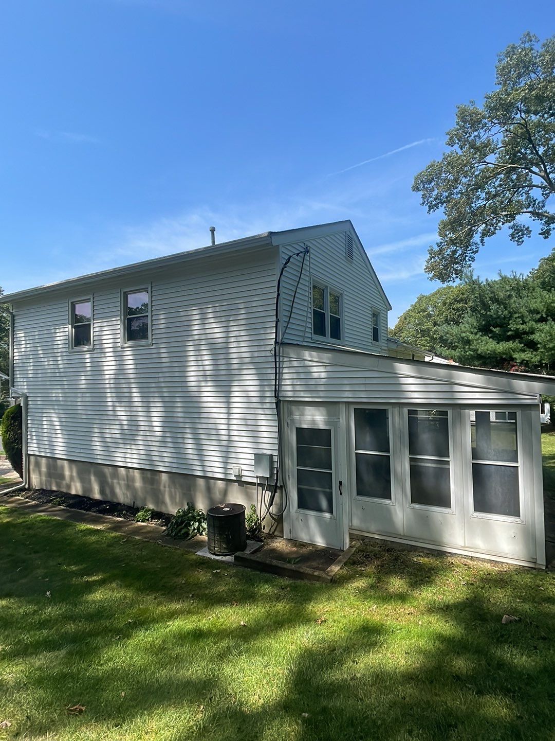 House Wash & Roof SoftWash (rear four season room) by SJ Exterior