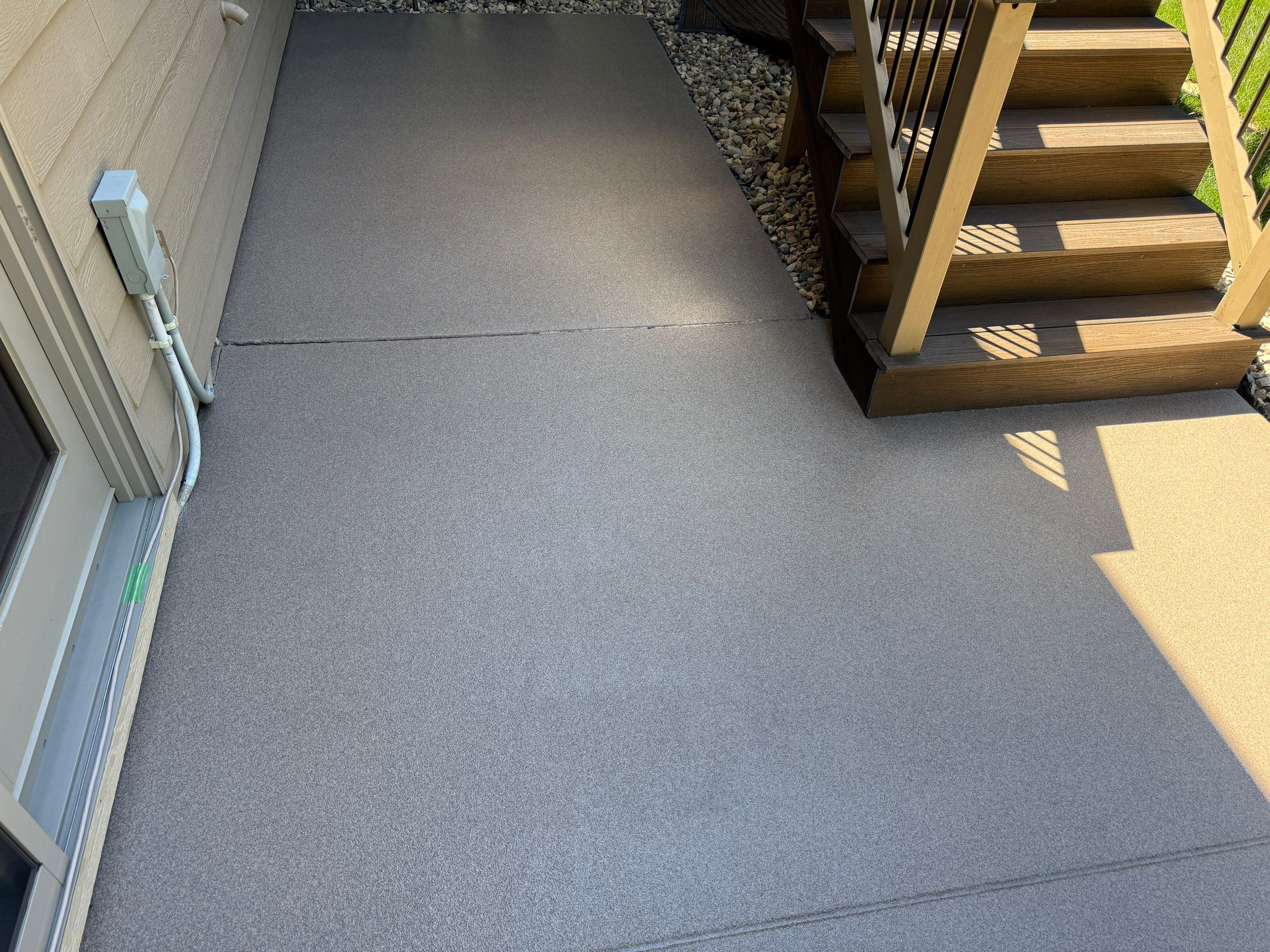 Textured Concrete Coating and Paver Patio Refresh in Sioux Falls by Select Painting, Coatings & Garage Cabinets