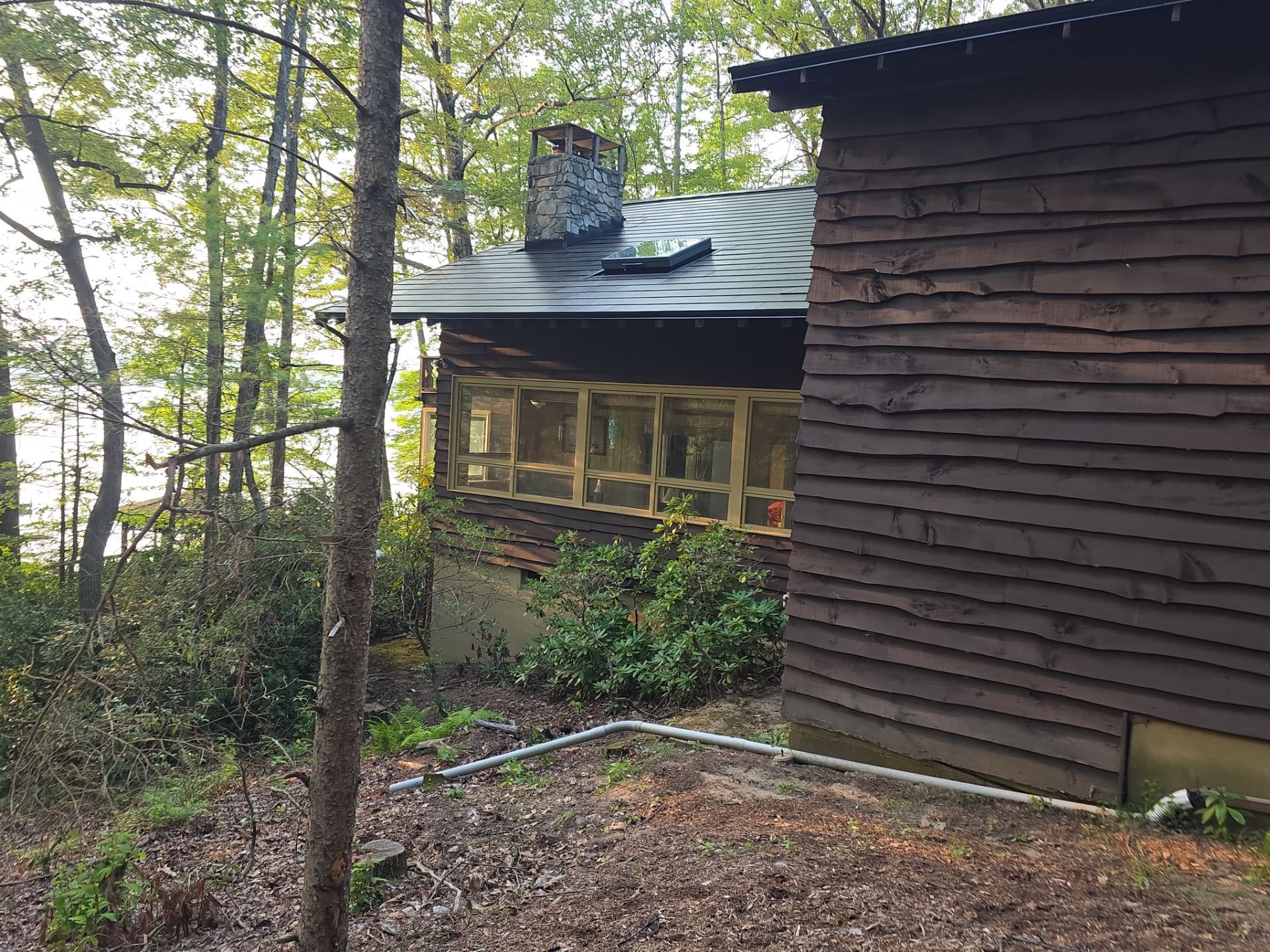 Stunning Tesla Solar Roof Cabin in the Woods by American Home Contractors