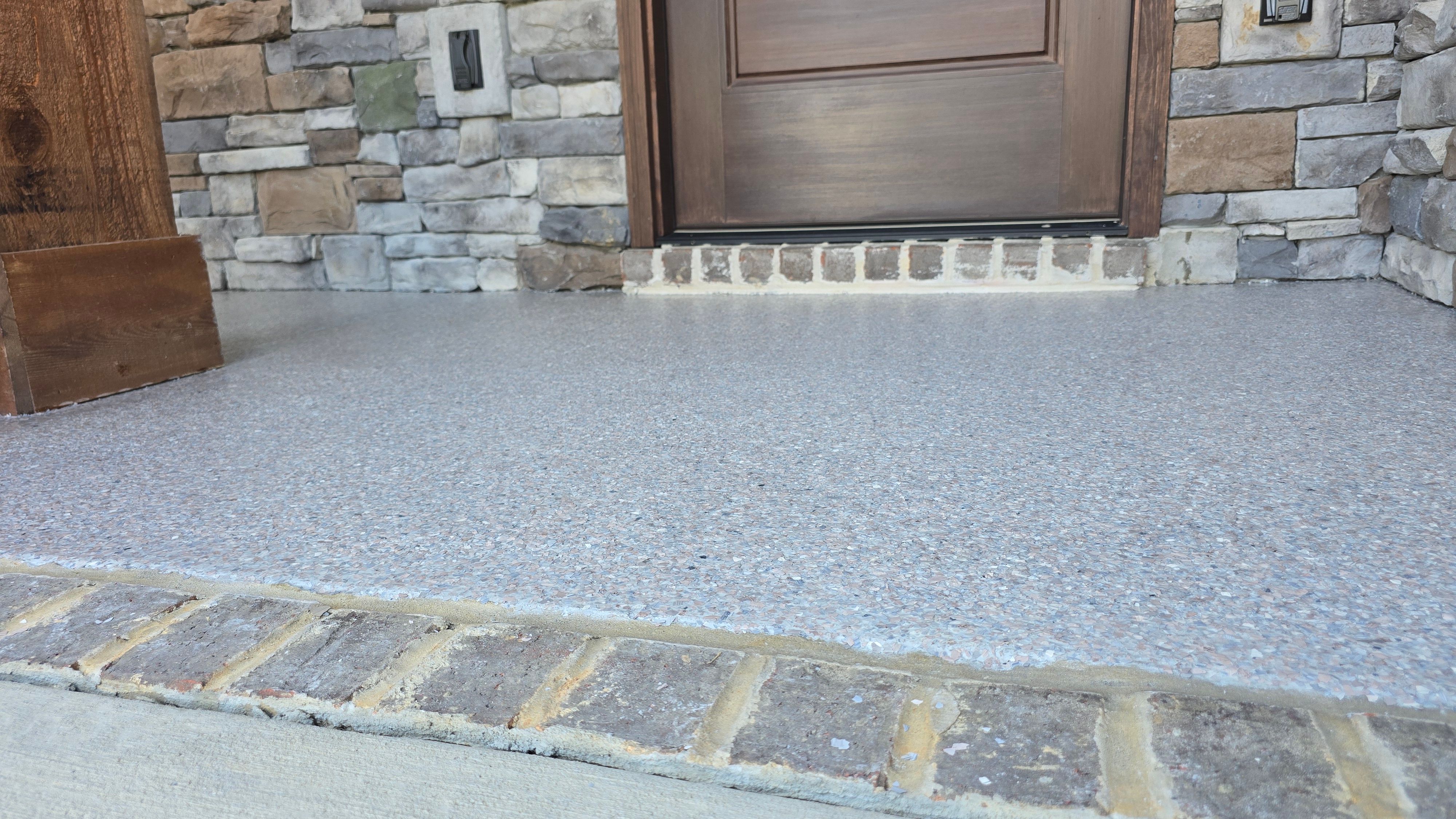 Porch & Patio Completed Using Obsidian & Pumice by Elite Floor Solutions