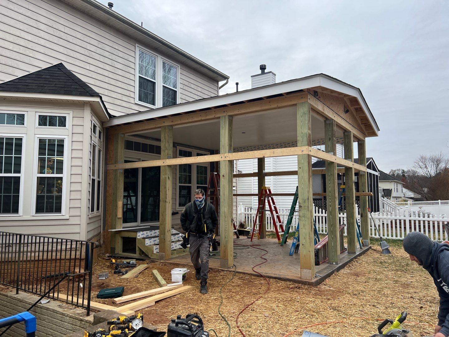 Custom Screened-In Porch with Stamped Concrete Patio in Warrenton by Jakari Restoration & Construction LLC