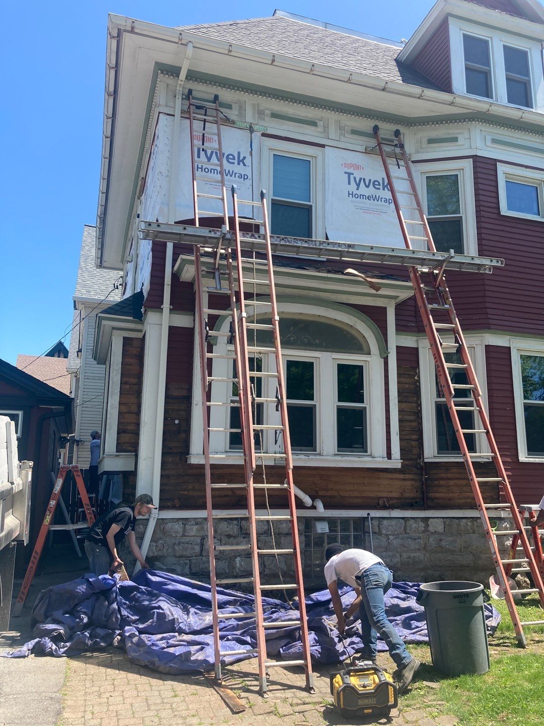 Exterior Renovations- Siding, Stamped Concrete, Porch, and Railings by Ivy Lea Construction
